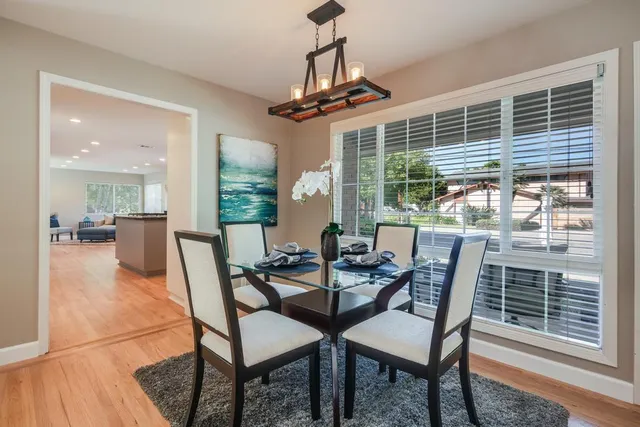 a view of a dining room with furniture window and outside view