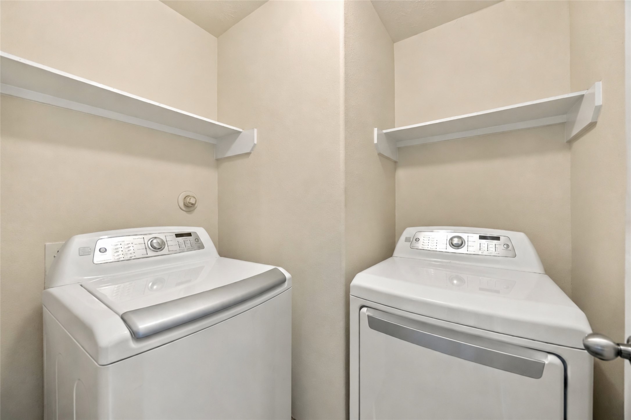 8338 Rudy Brook Way Spring, TX 77379 - Photo 27 of 33 The dedicated laundry room keeps everyday chores organized with convenient shelving and storage