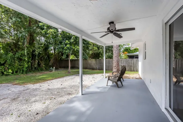 a view of a room with porch and wooden floor
