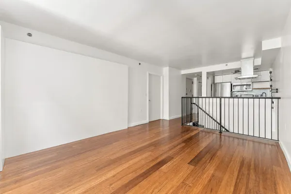 a view of a livingroom with wooden floor
