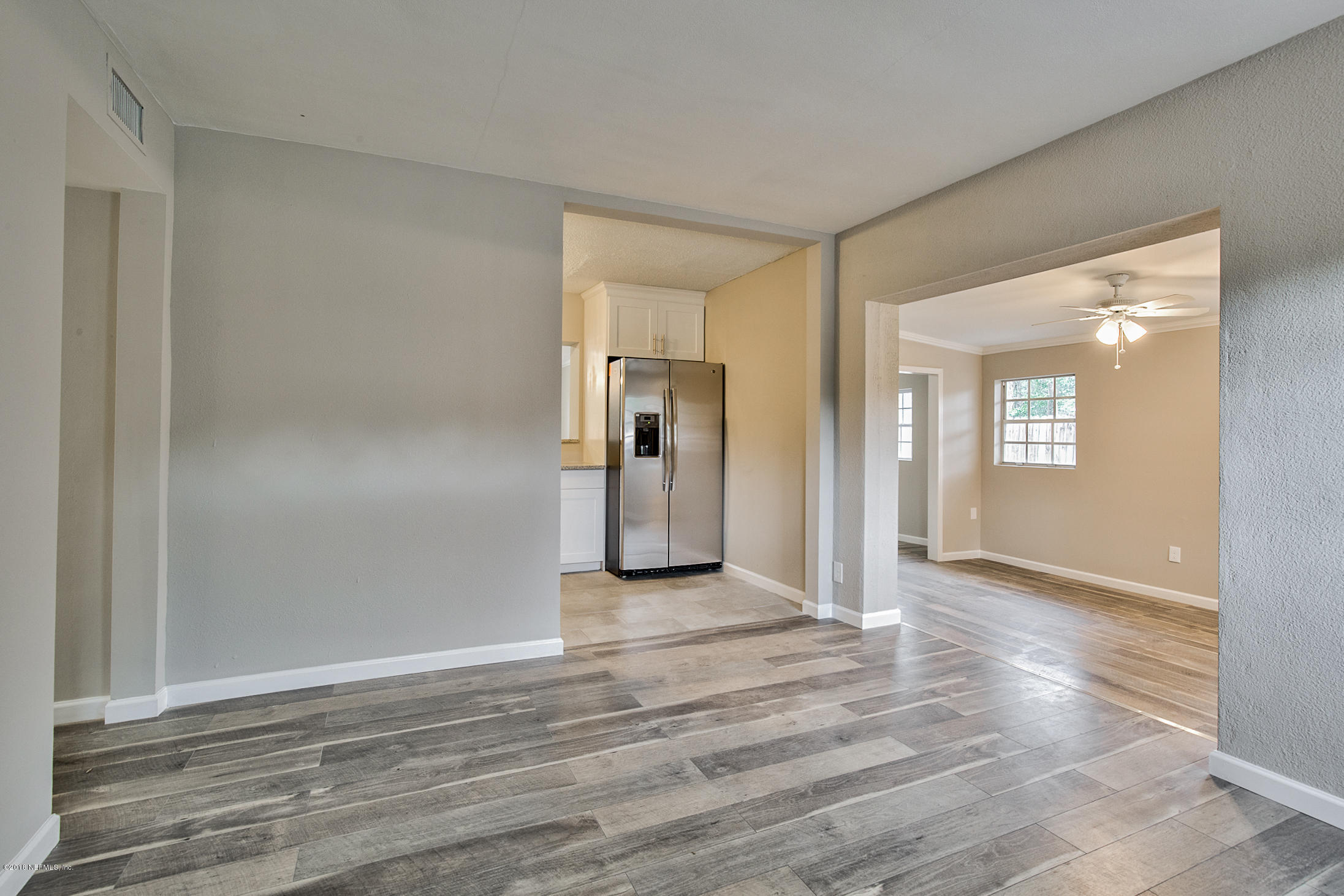 2846 Kline Road Jacksonville, FL 32246 - Photo 11 of 51 a view of a room with wooden floor and a bathroom