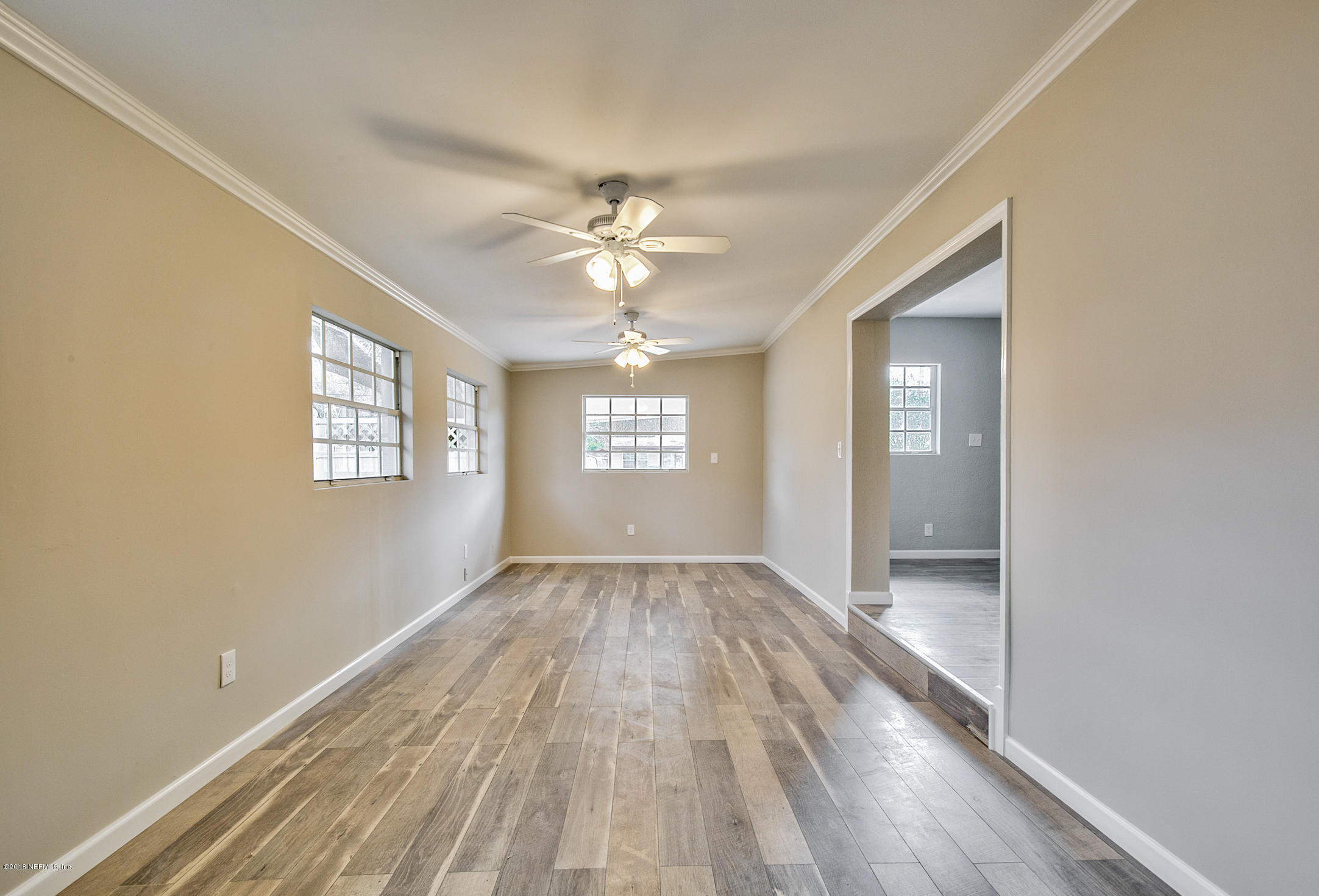 2846 Kline Road Jacksonville, FL 32246 - Photo 17 of 51 a view of an empty room window and wooden floor
