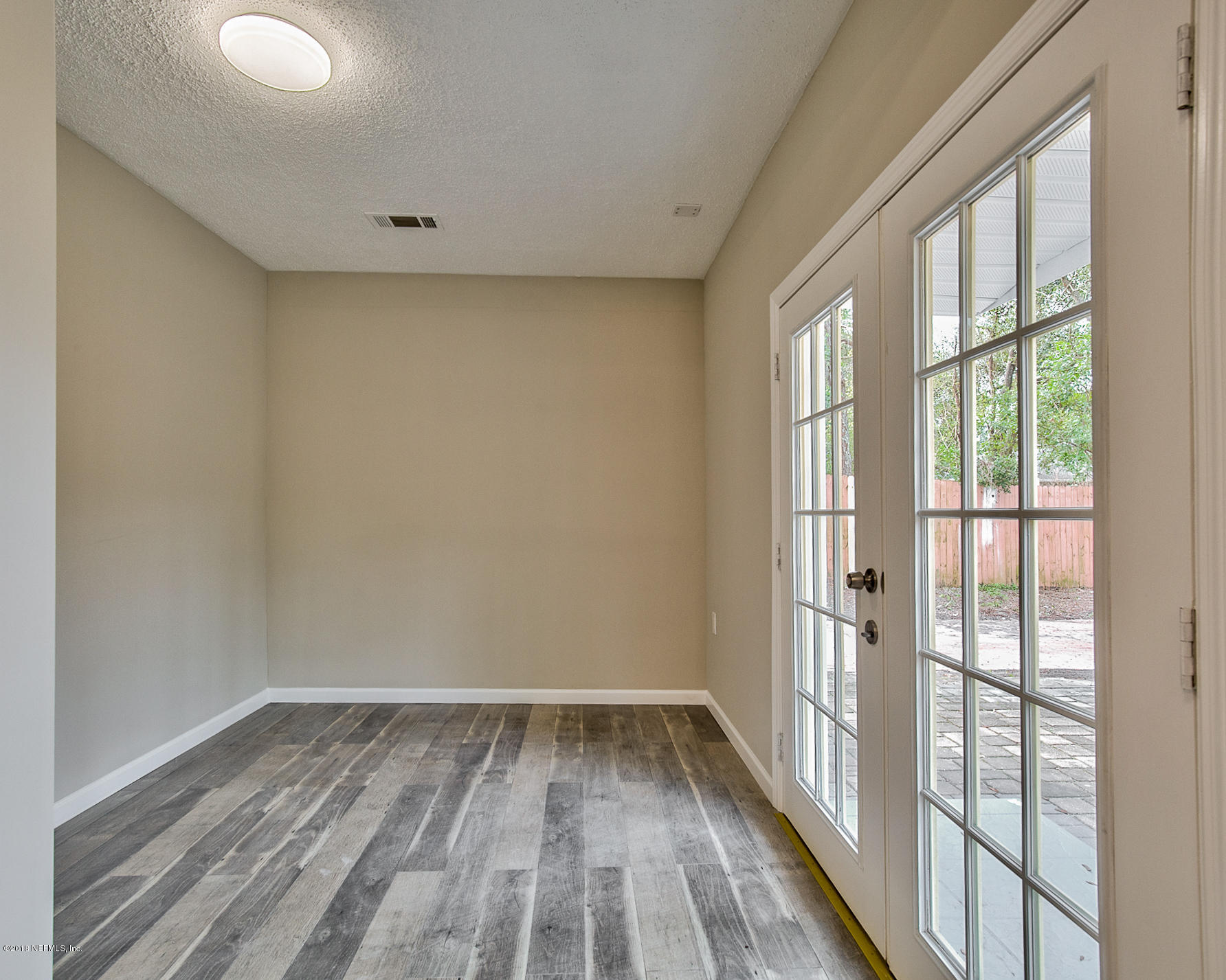 2846 Kline Road Jacksonville, FL 32246 - Photo 26 of 51 a view of a room with wooden floor and windows