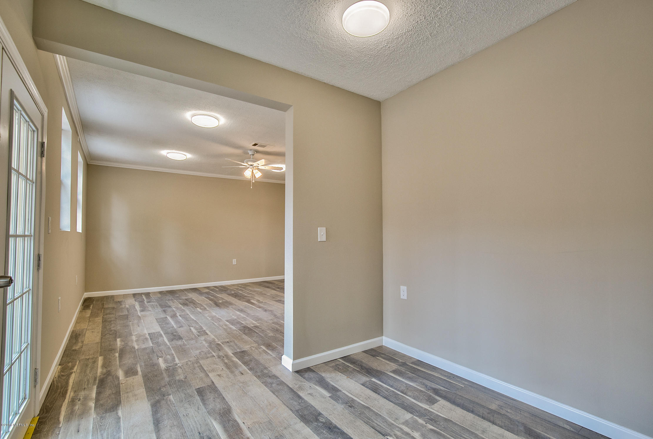 2846 Kline Road Jacksonville, FL 32246 - Photo 28 of 51 a view of an empty room with wooden floor
