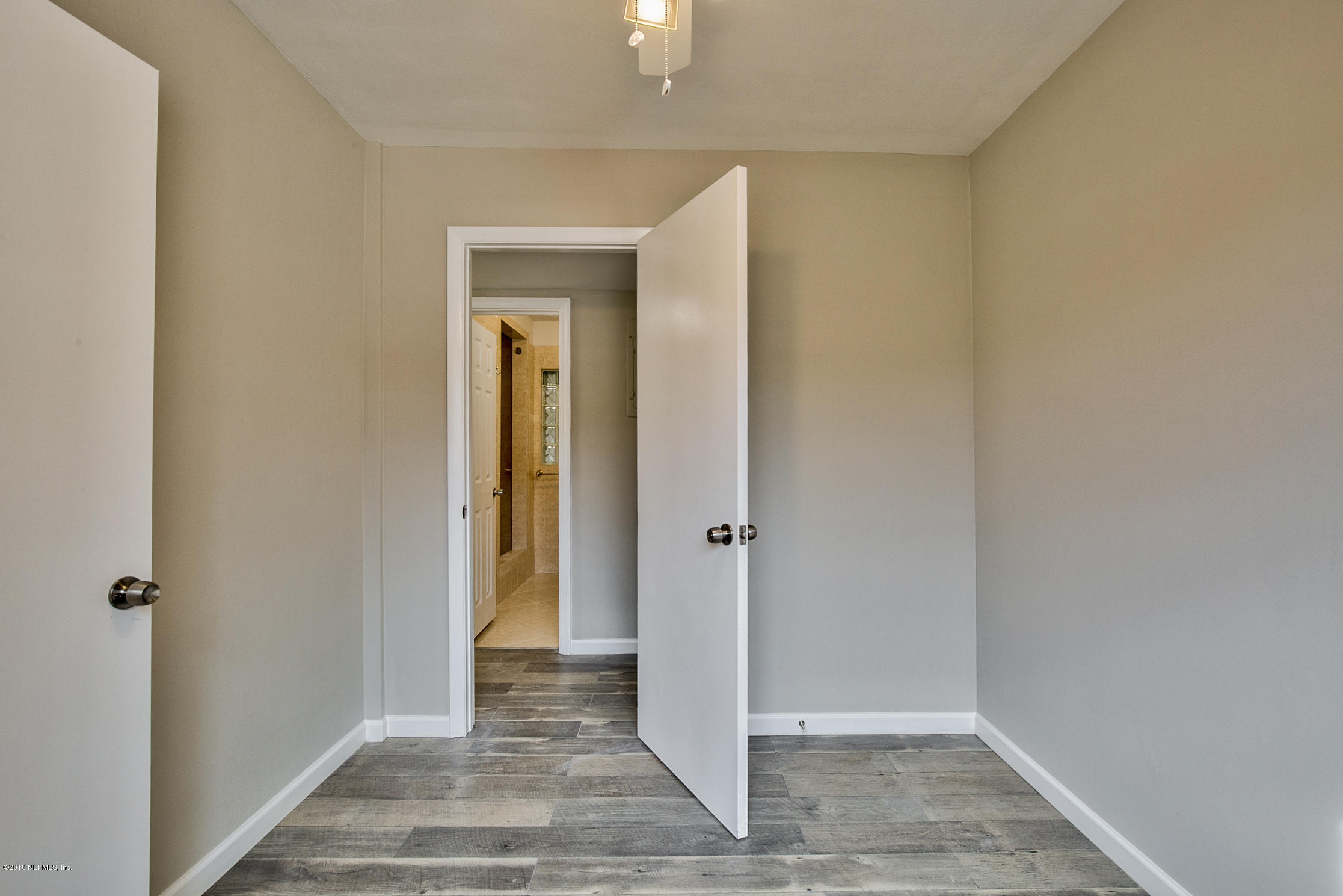 2846 Kline Road Jacksonville, FL 32246 - Photo 32 of 51 a view of a hallway with wooden floor and closet