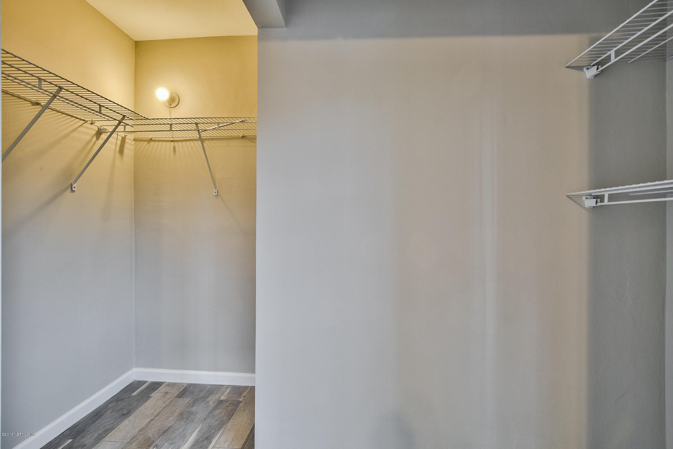 2846 Kline Road Jacksonville, FL 32246 - Photo 39 of 51 a view of walk in closet with empty racks