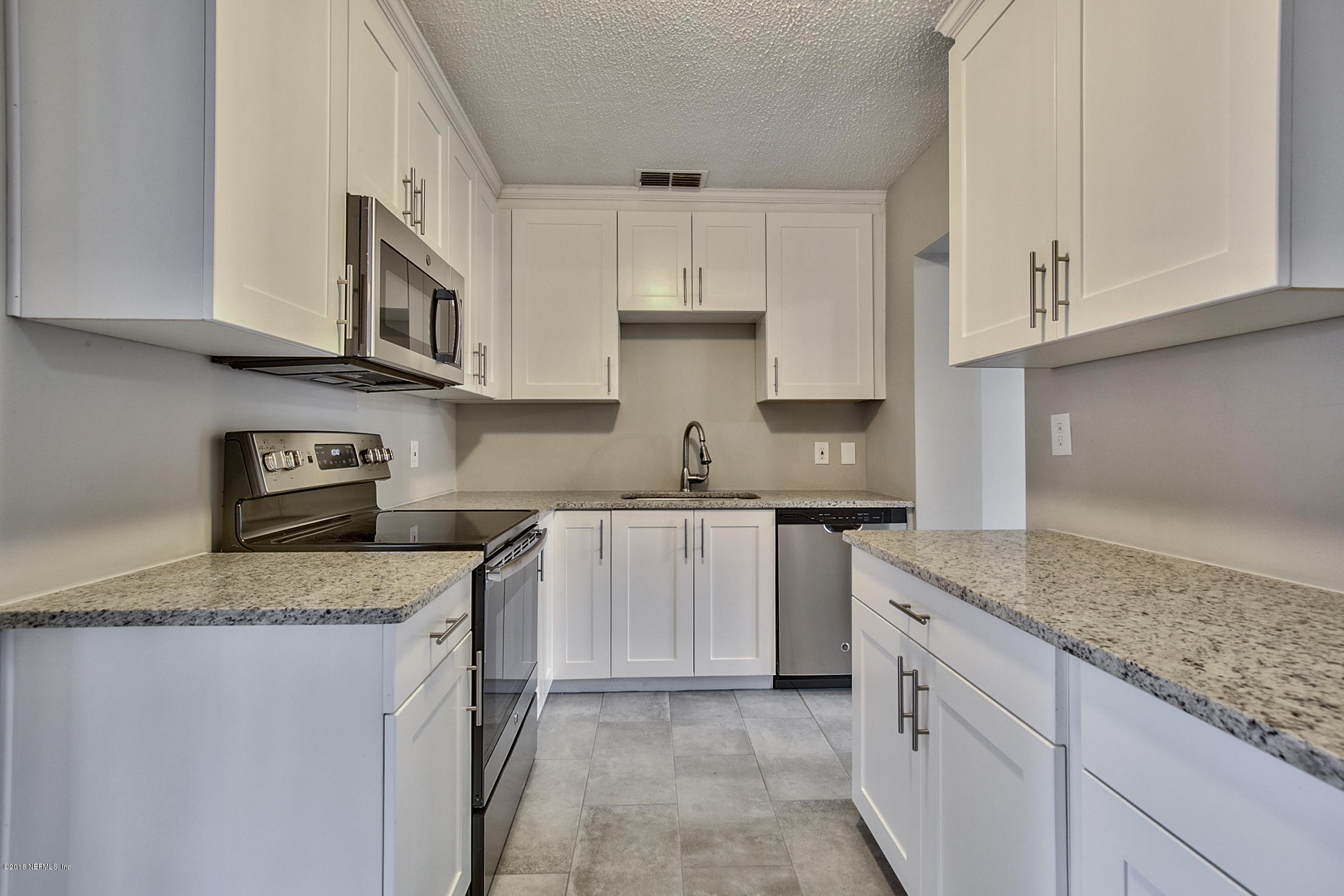 2846 Kline Road Jacksonville, FL 32246 - Photo 4 of 51 a kitchen with stainless steel appliances granite countertop a sink stove and cabinets