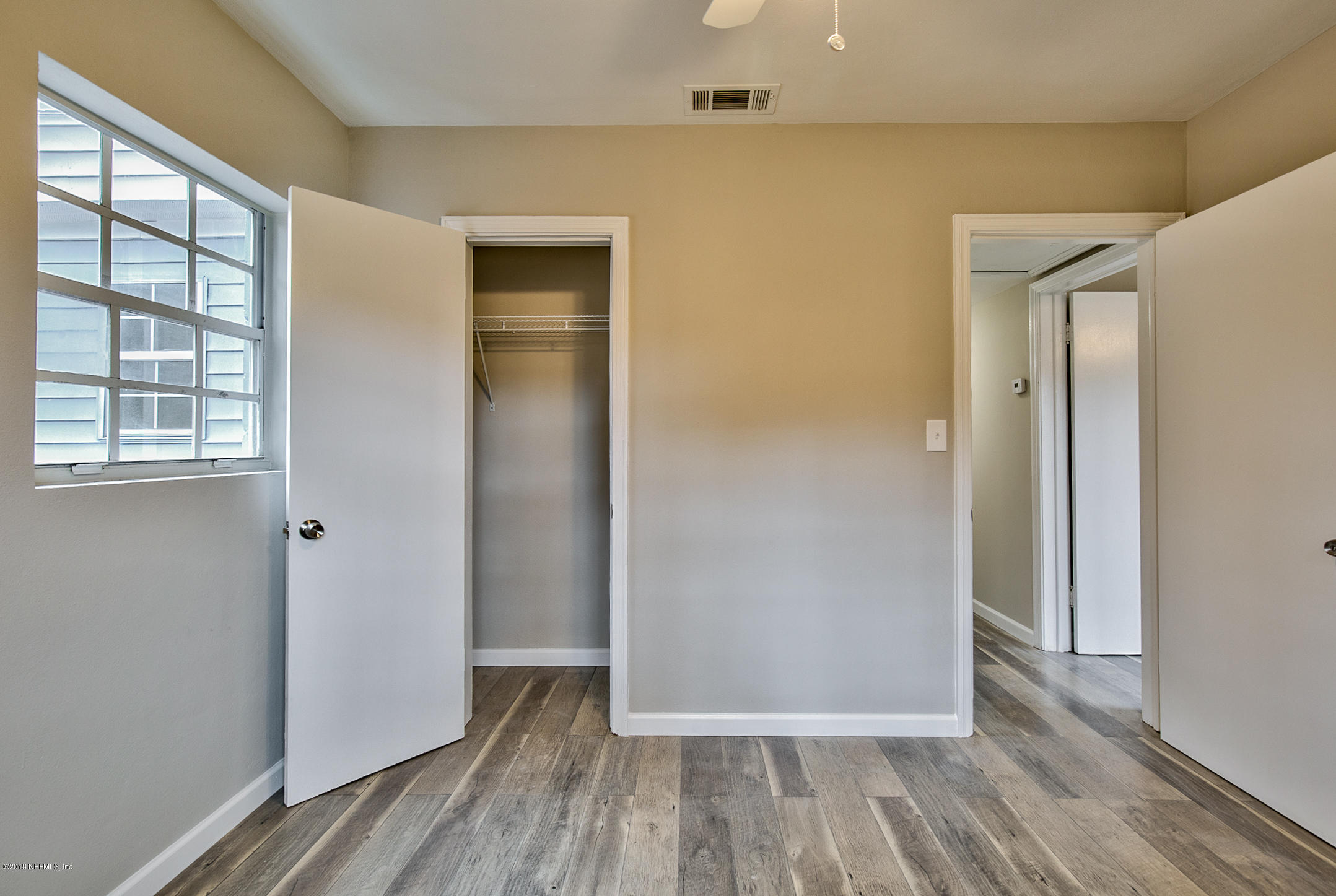 2846 Kline Road Jacksonville, FL 32246 - Photo 42 of 51 a view of a hallway with wooden floor and closet area