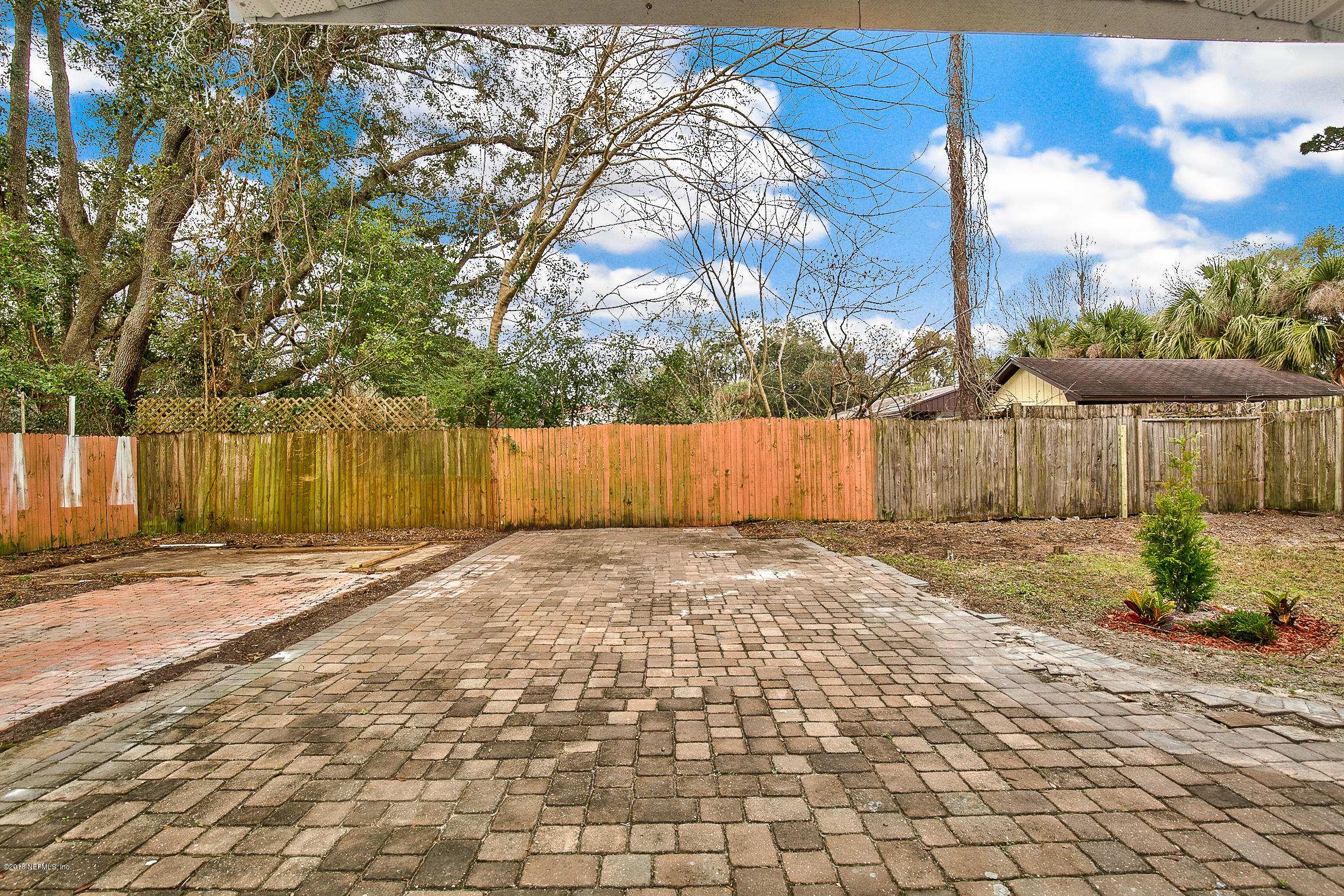 2846 Kline Road Jacksonville, FL 32246 - Photo 43 of 51 a view of a backyard with wooden fence