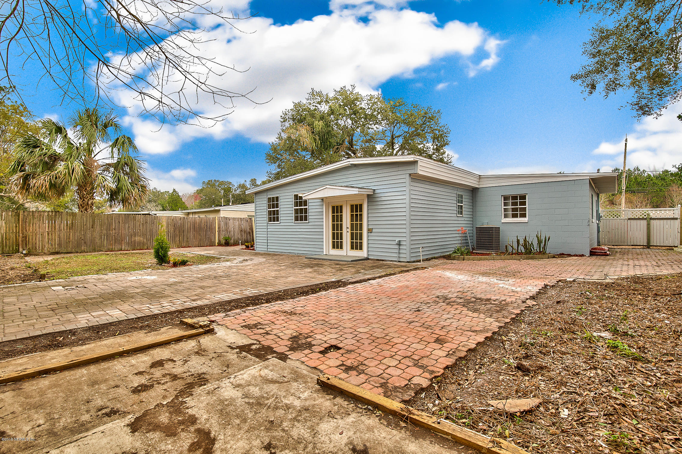 2846 Kline Road Jacksonville, FL 32246 - Photo 45 of 51 a front view of a house with a yard and garage