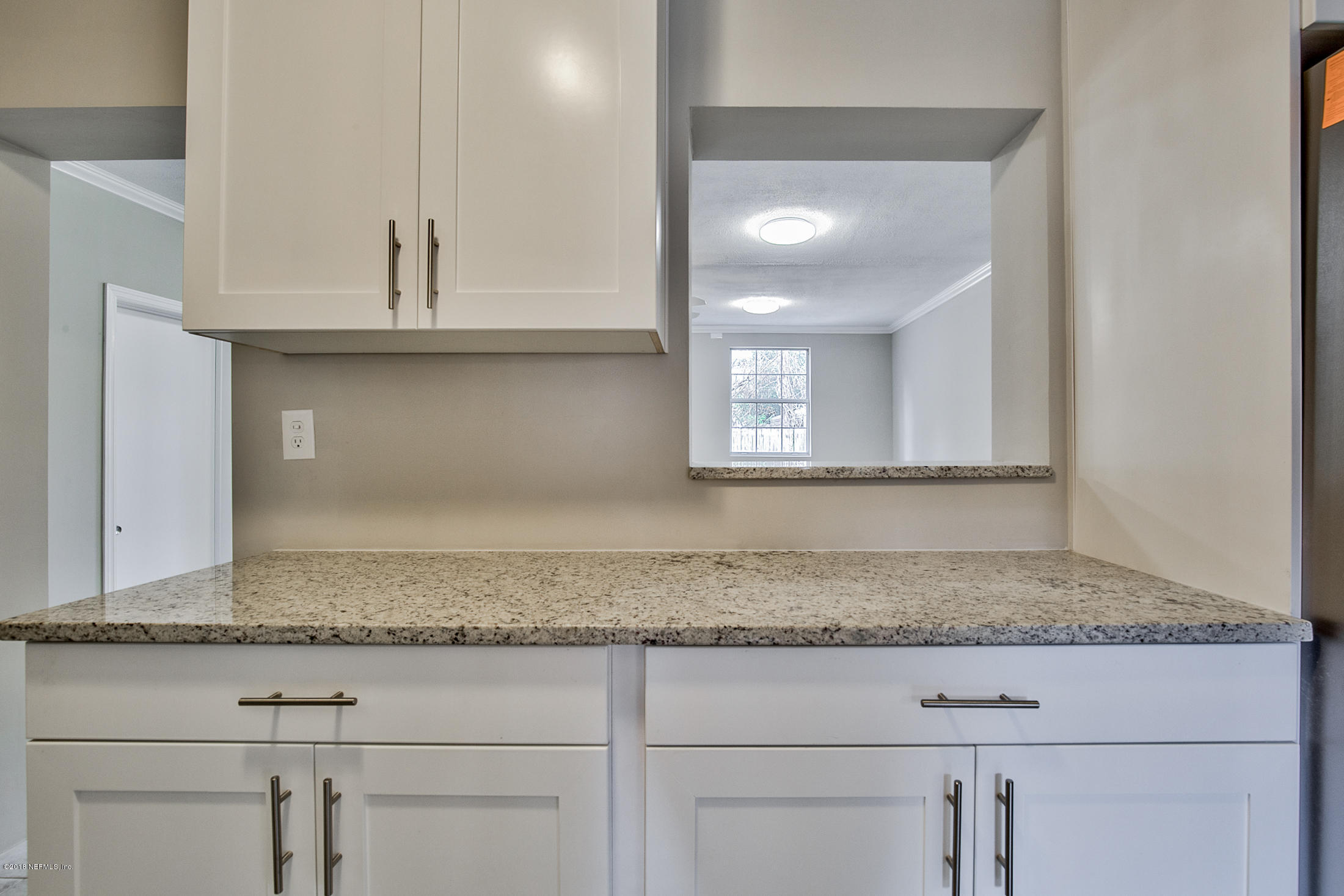 2846 Kline Road Jacksonville, FL 32246 - Photo 6 of 51 a bathroom with granite countertop granite countertop white cabinets and a granite counter top