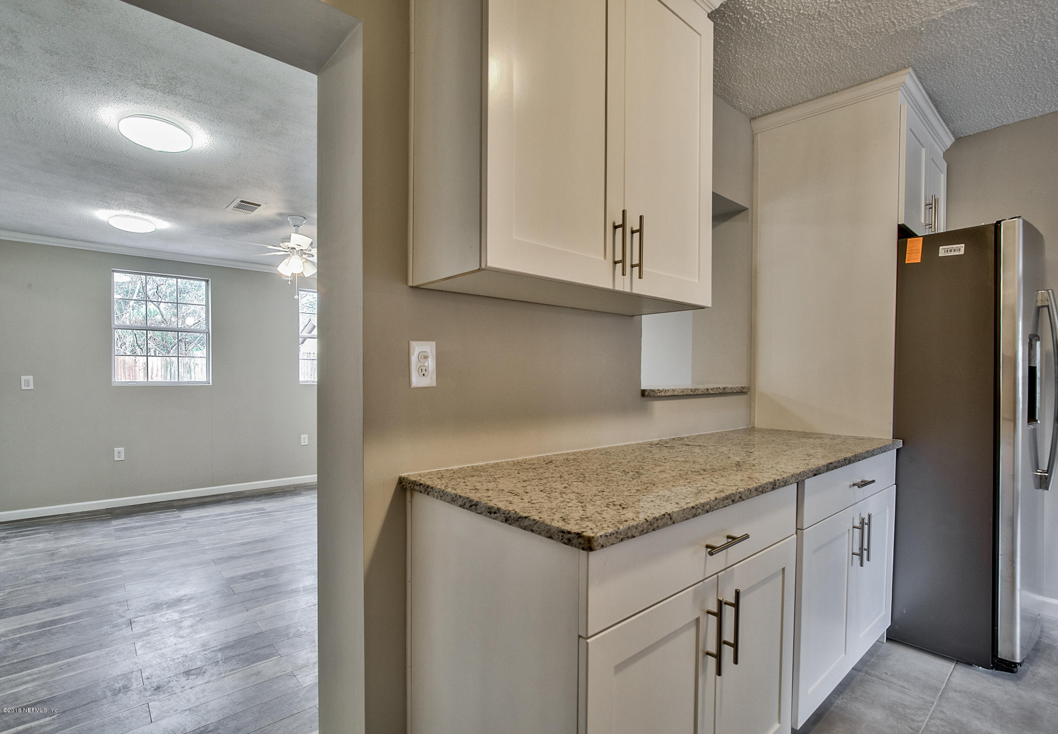 2846 Kline Road Jacksonville, FL 32246 - Photo 7 of 51 a kitchen with stainless steel appliances granite countertop a refrigerator and a sink