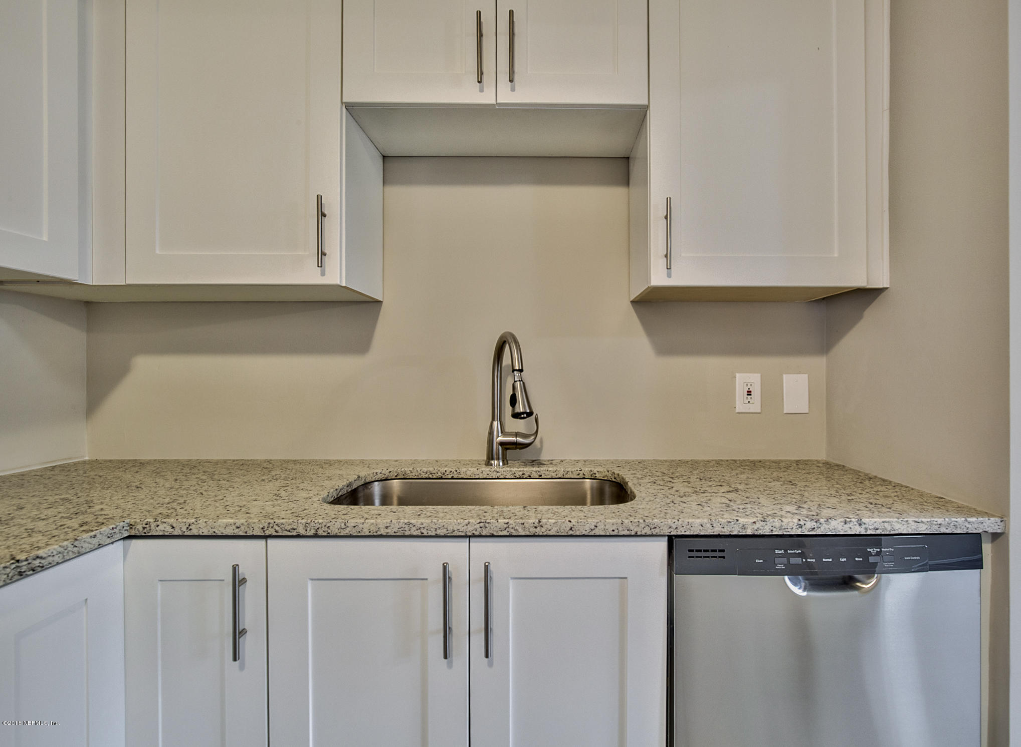 2846 Kline Road Jacksonville, FL 32246 - Photo 8 of 51 a kitchen with granite countertop white cabinets and a sink