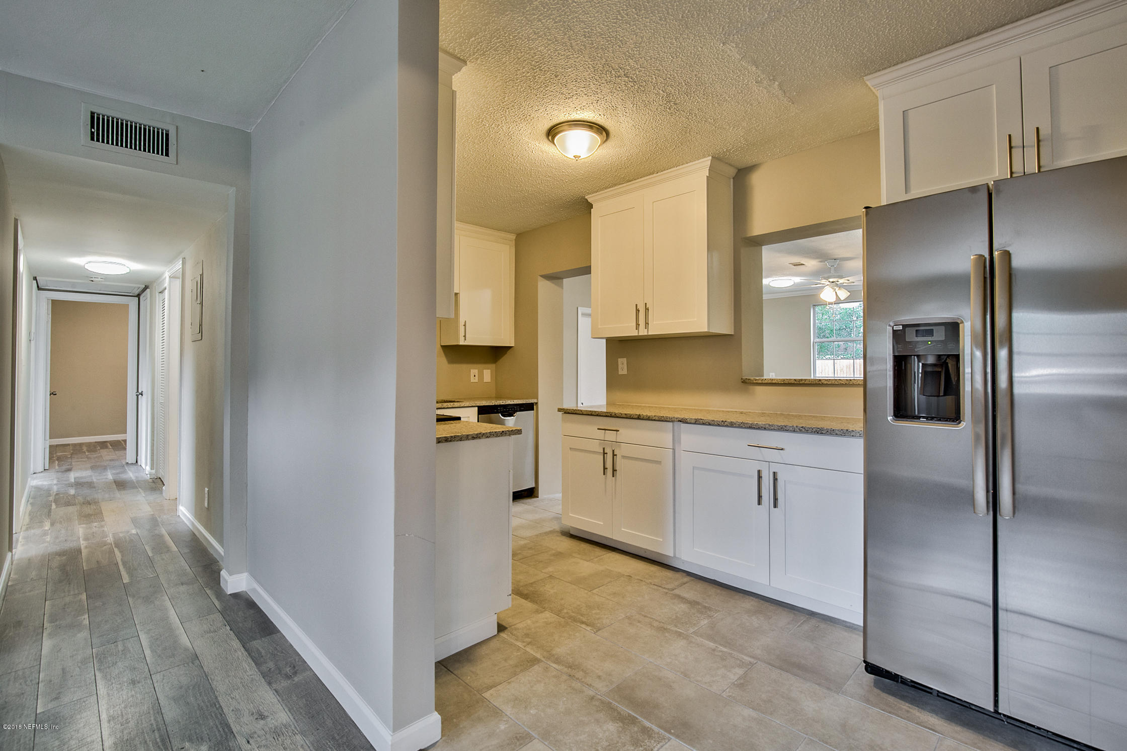 2846 Kline Road Jacksonville, FL 32246 - Photo 9 of 51 a kitchen with cabinets and stainless steel appliances