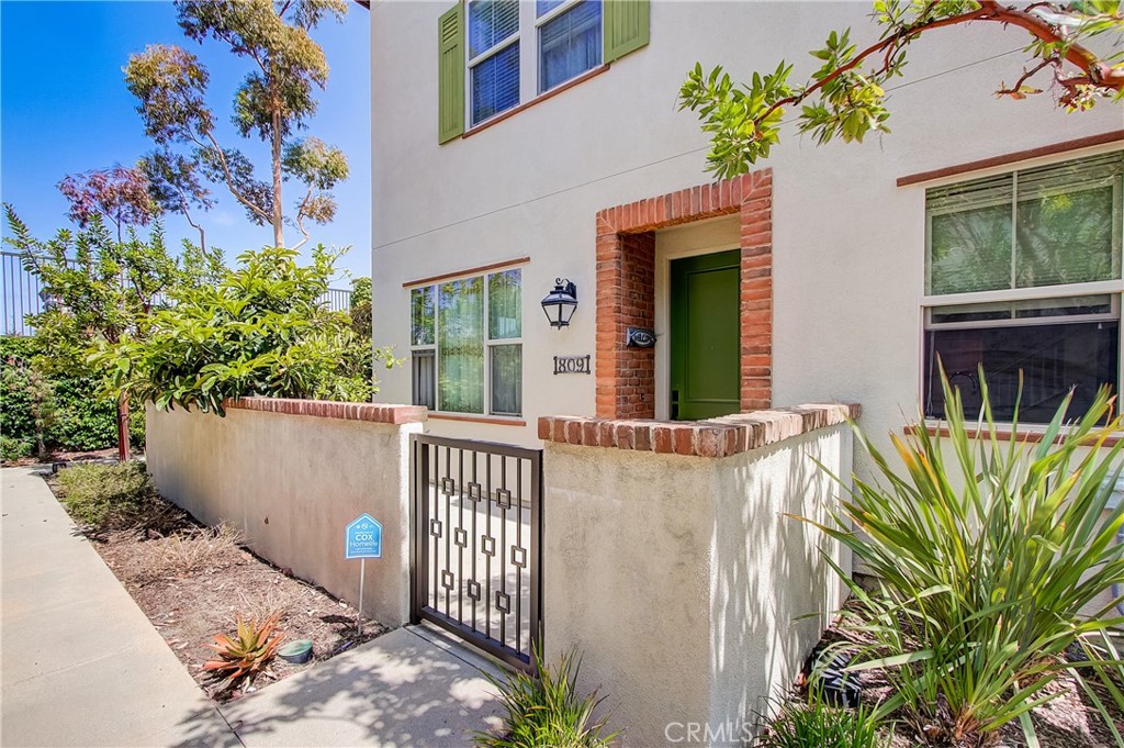 front view of a house with potted plants