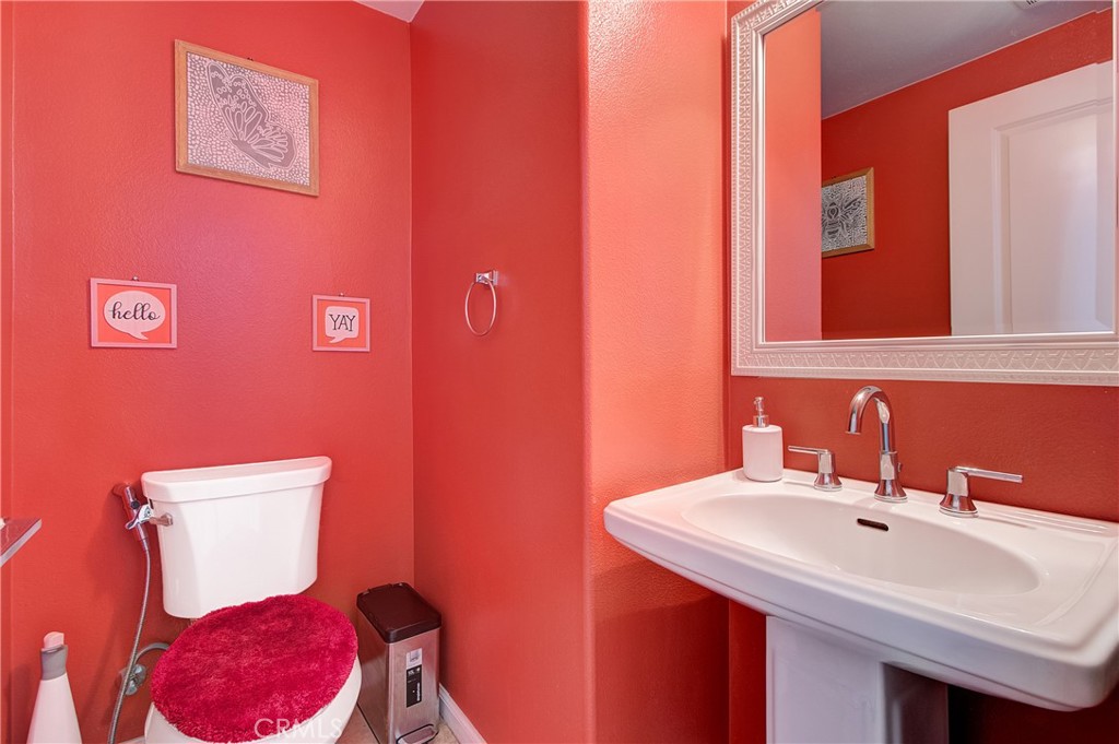 809 El Paseo Lake Forest, CA 92610 - Photo 14 of 45 a bathroom with a sink and a toilet
