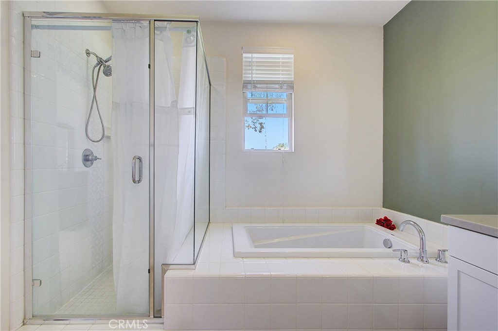 809 El Paseo Lake Forest, CA 92610 - Photo 19 of 45 a bathroom with a bathtub
