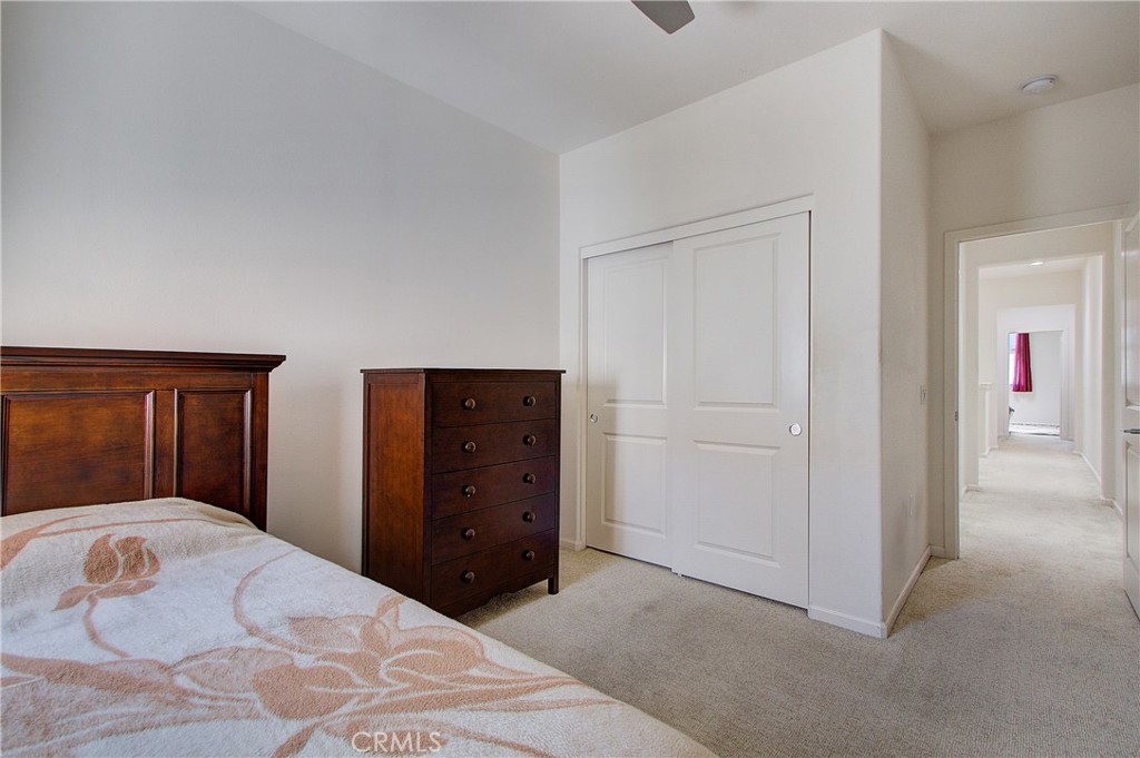 809 El Paseo Lake Forest, CA 92610 - Photo 21 of 45 a bedroom with a bed and a closet