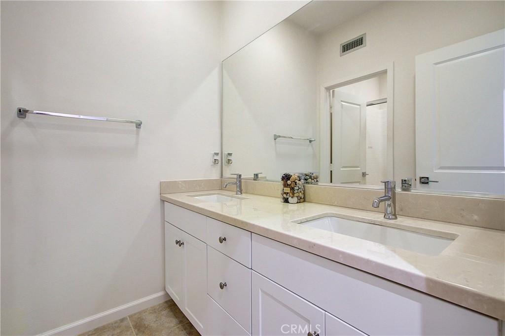 809 El Paseo Lake Forest, CA 92610 - Photo 22 of 45 a bathroom with a sink and a mirror