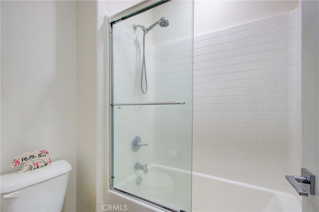 809 El Paseo Lake Forest, CA 92610 - Photo 23 of 45 a bathroom with a shower a toilet and a sink