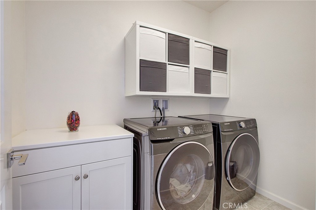 809 El Paseo Lake Forest, CA 92610 - Photo 26 of 45 a utility room with dryer and washer