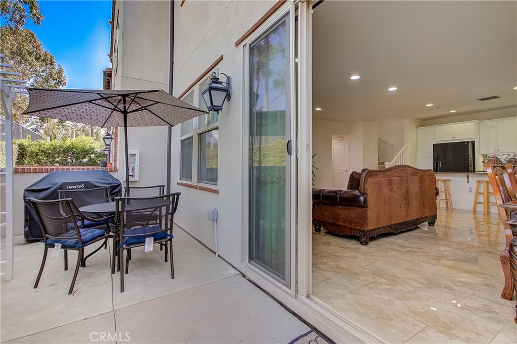 809 El Paseo Lake Forest, CA 92610 - Photo 30 of 45 a living room with furniture and a flat screen tv
