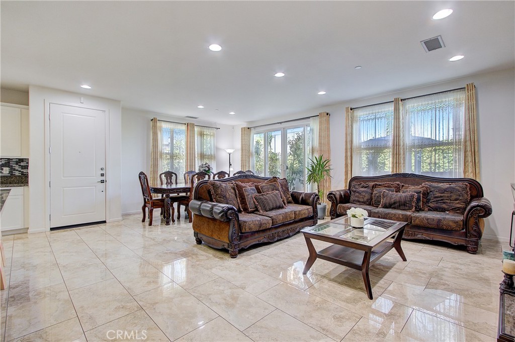 809 El Paseo Lake Forest, CA 92610 - Photo 3 of 45 a living room with furniture and a window