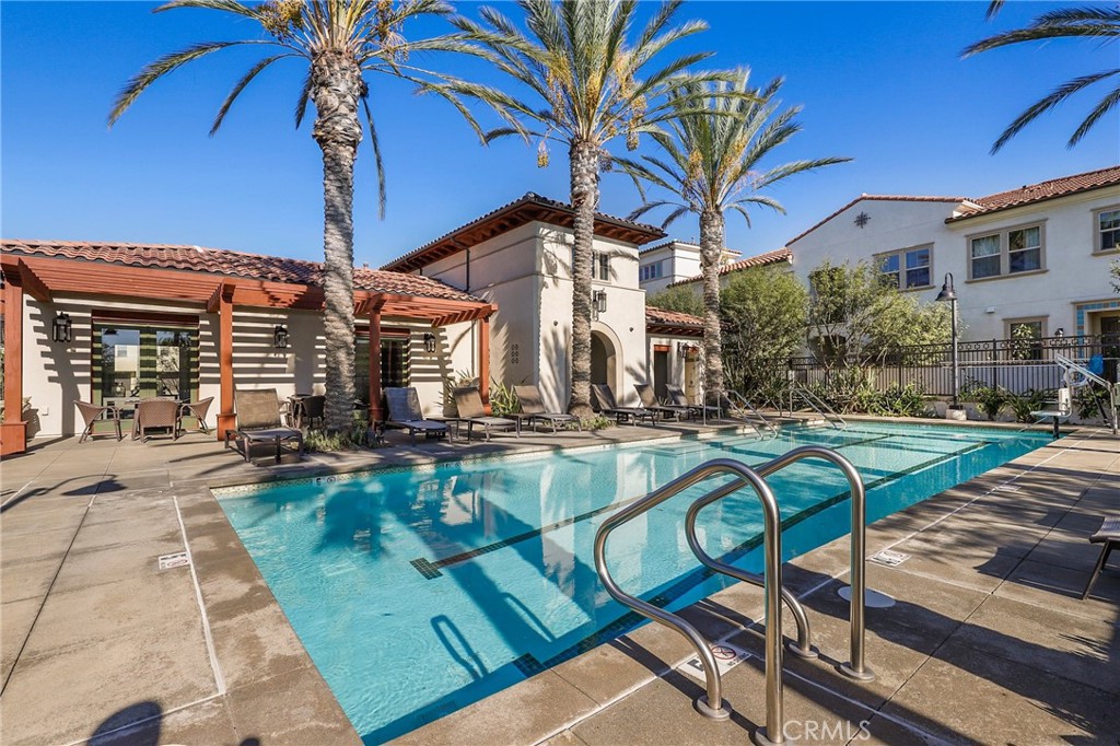 809 El Paseo Lake Forest, CA 92610 - Photo 39 of 45 a view of a house with swimming pool patio and a yard