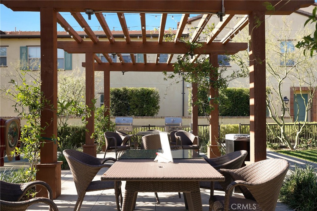 809 El Paseo Lake Forest, CA 92610 - Photo 43 of 45 a view of a patio with table and chairs and potted plants