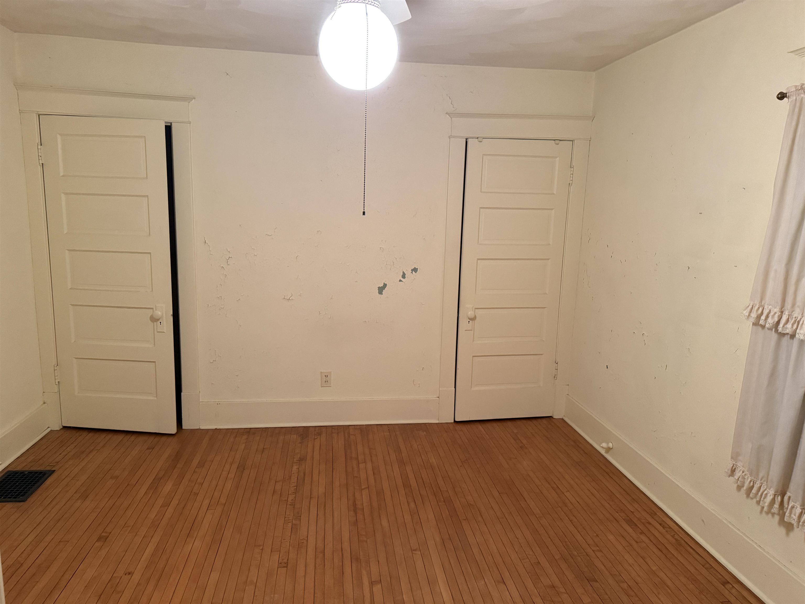 1629 West Harrison Street Freeport, IL 61032 - Photo 19 of 36 an empty room with wooden floor