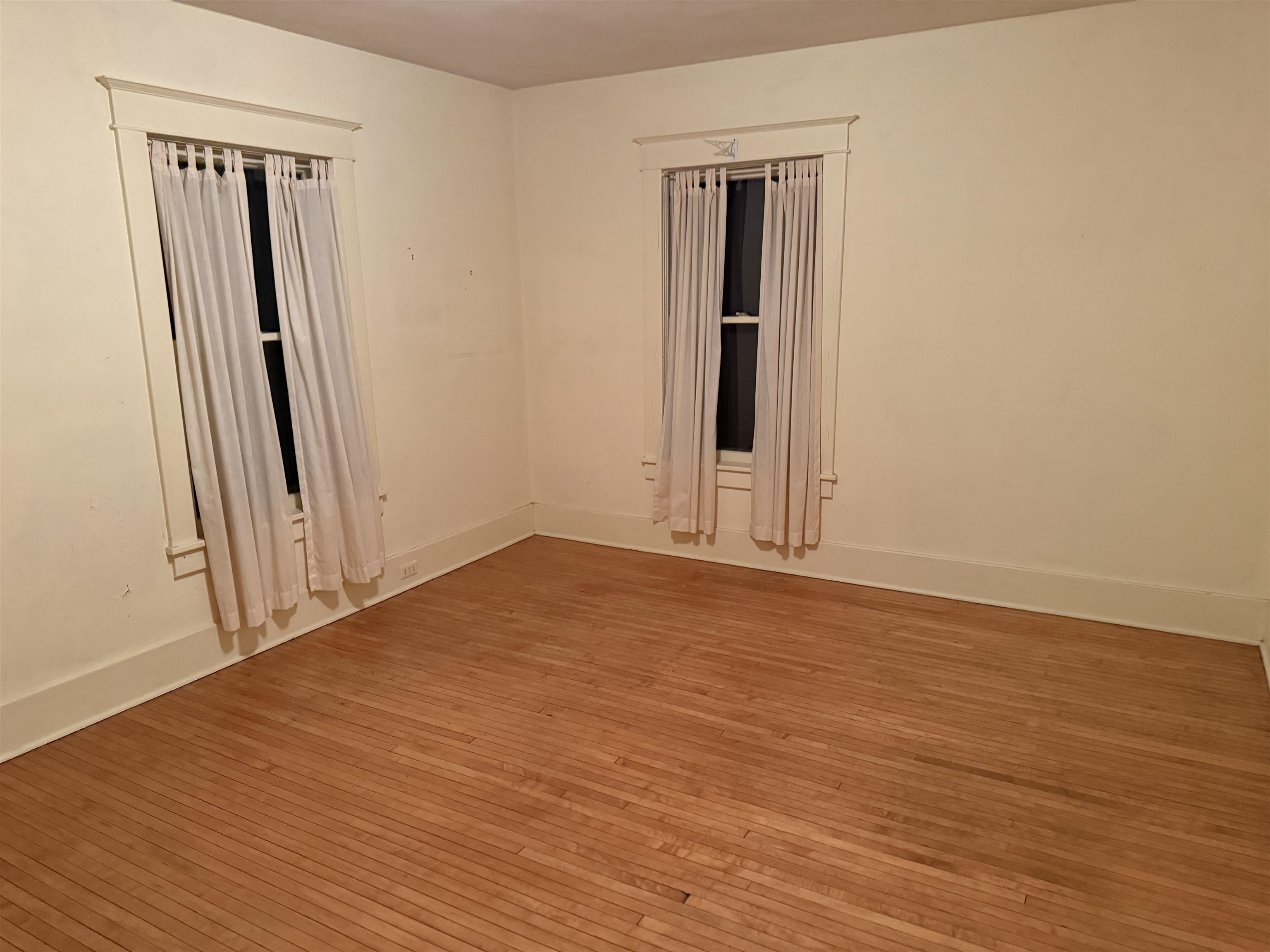1629 West Harrison Street Freeport, IL 61032 - Photo 21 of 36 an empty room with wooden floor and closet