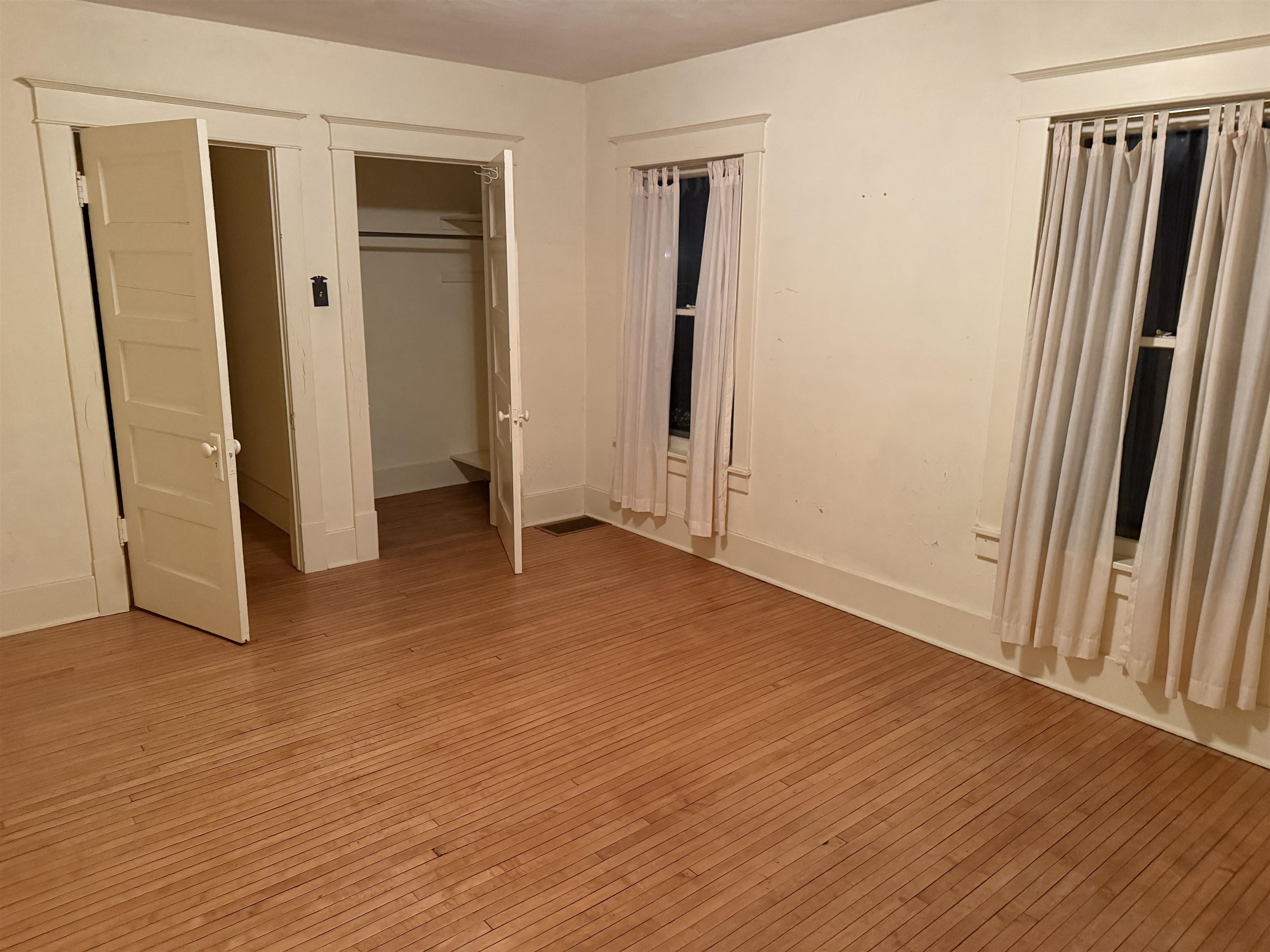 1629 West Harrison Street Freeport, IL 61032 - Photo 22 of 36 an empty room with wooden floor and closet area