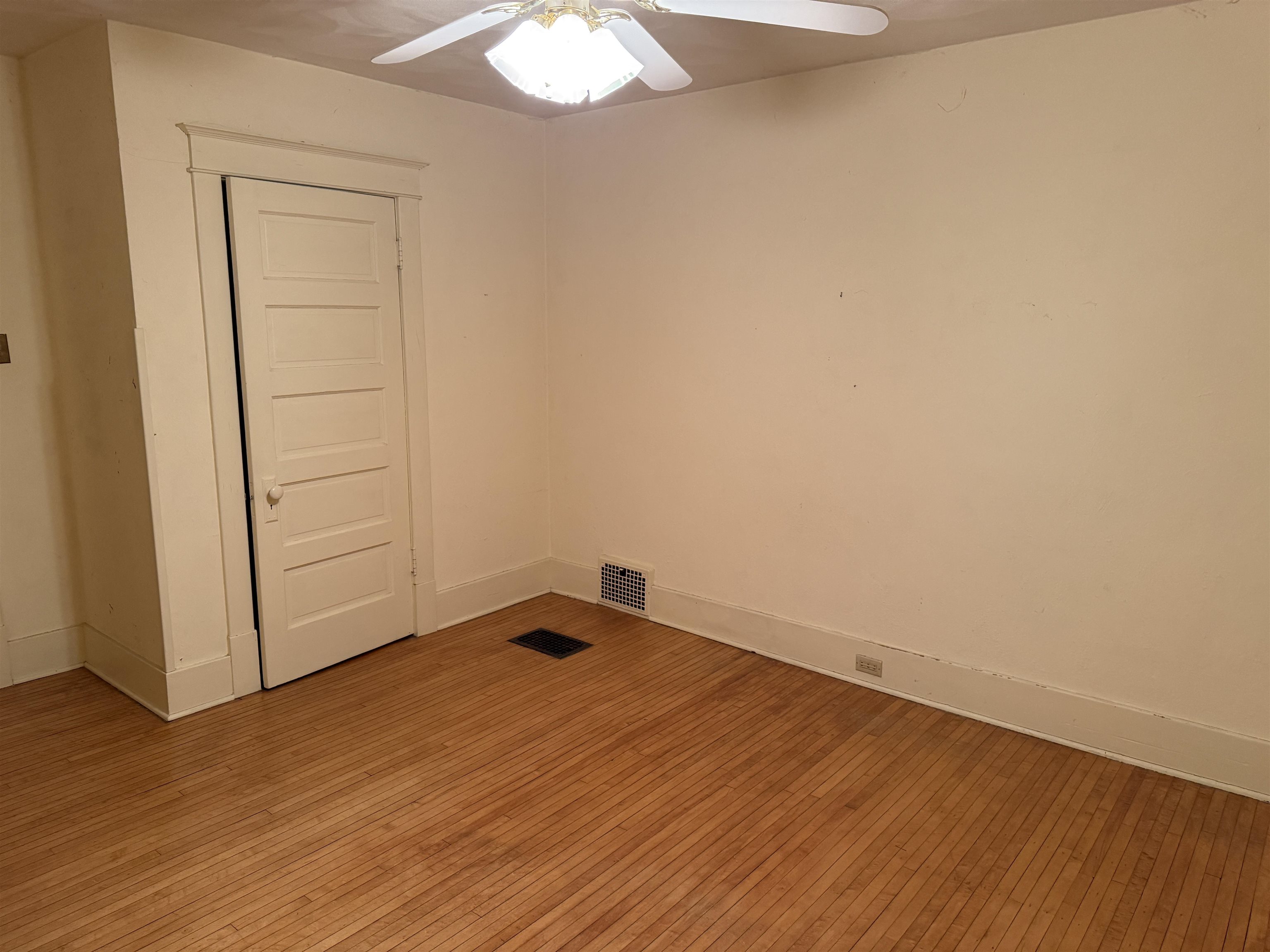 1629 West Harrison Street Freeport, IL 61032 - Photo 24 of 36 an empty room with wooden floor