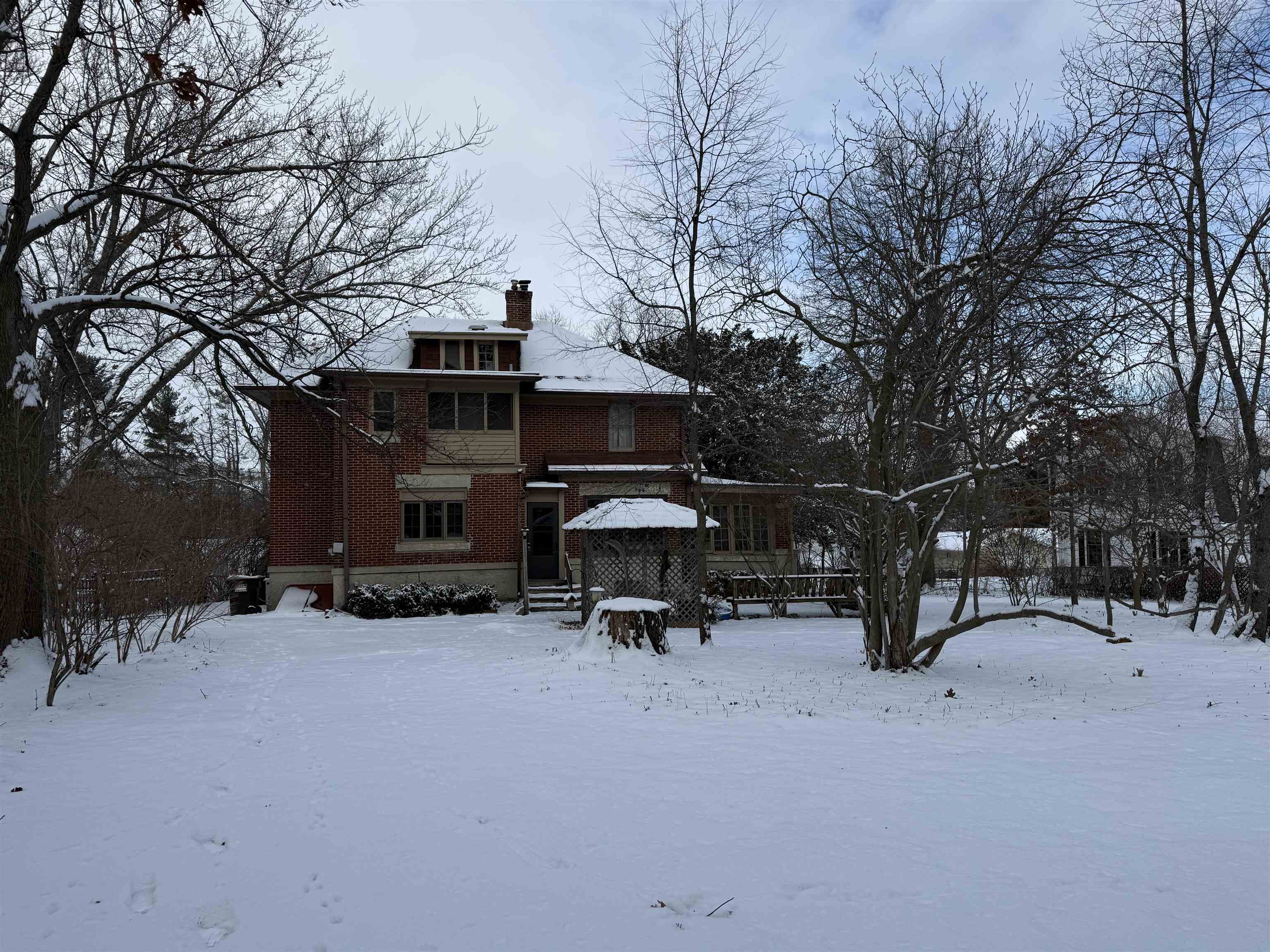 1629 West Harrison Street Freeport, IL 61032 - Photo 33 of 36 a view of a bench in the middle of a snow
