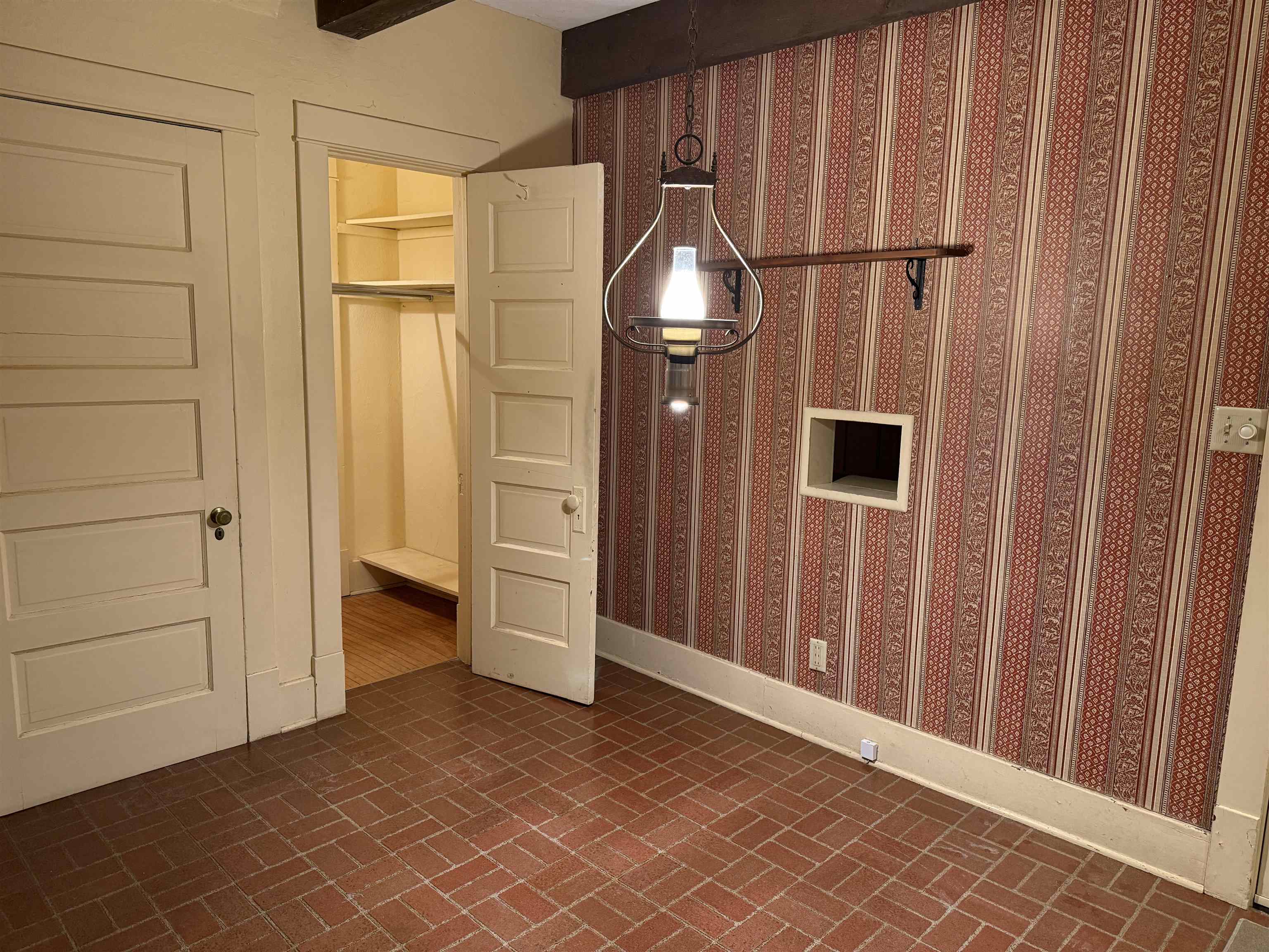 1629 West Harrison Street Freeport, IL 61032 - Photo 5 of 36 an empty room with wooden floor and windows