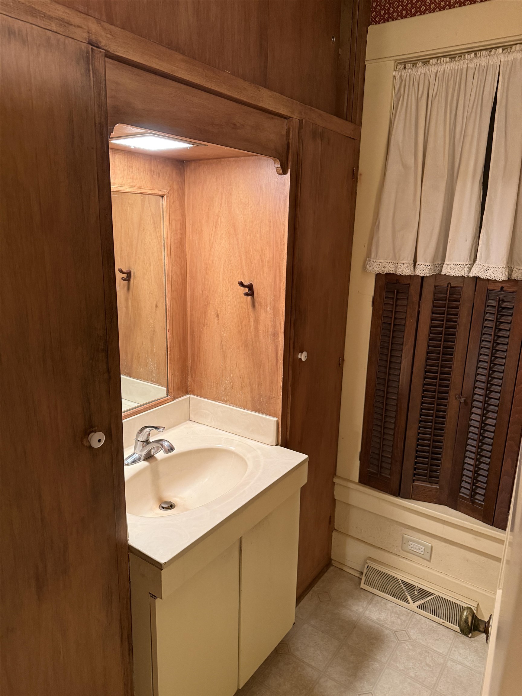 1629 West Harrison Street Freeport, IL 61032 - Photo 7 of 36 a bathroom with a sink a mirror and a shower