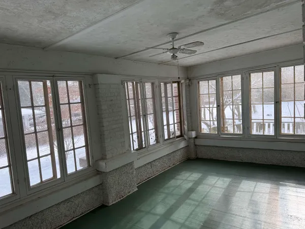 a bathroom with a granite countertop toilet and a shower