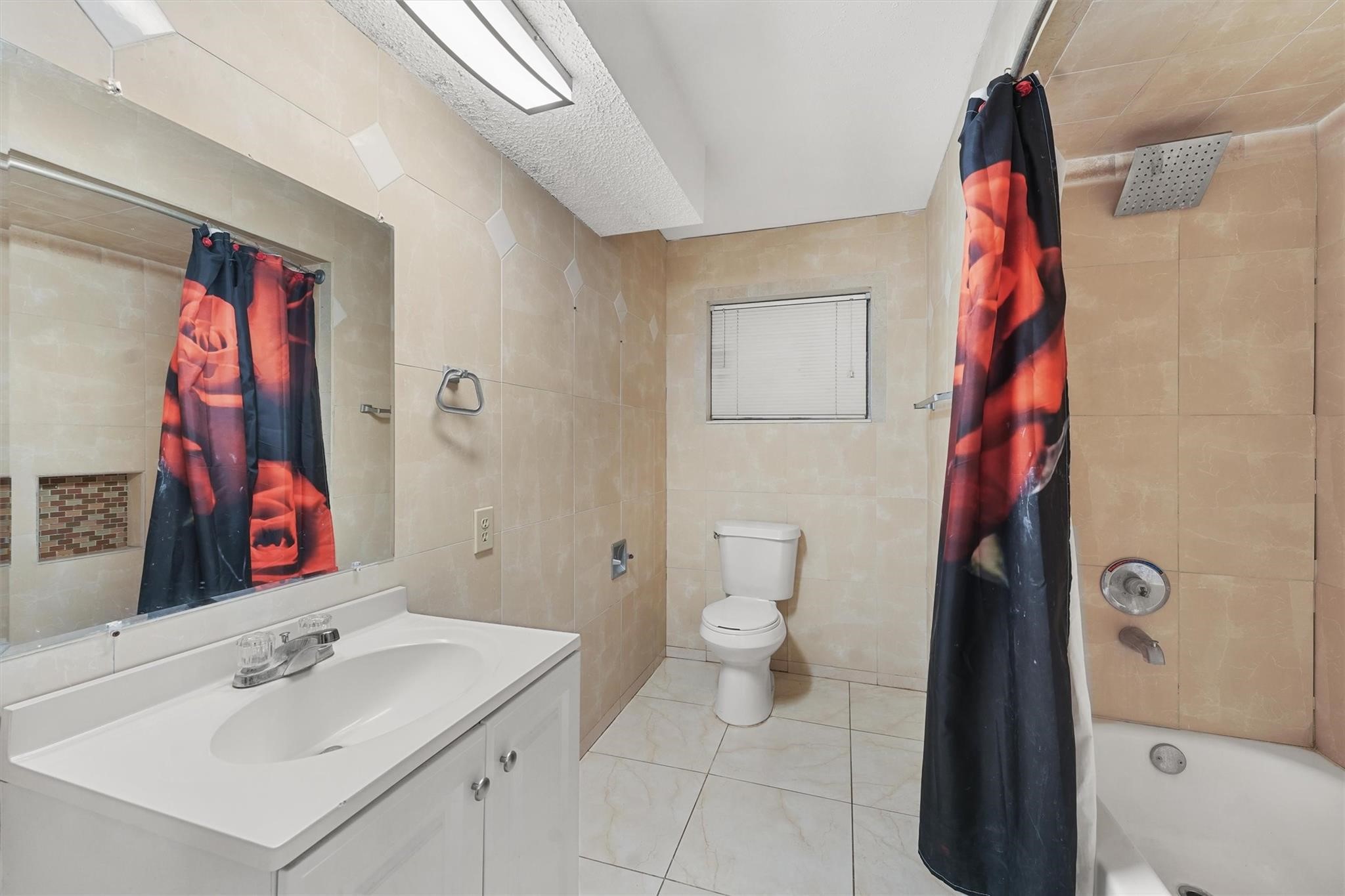 850 County Road 2145 Cleveland, TX 77327 - Photo 14 of 43 a bathroom with a sink a toilet and shower curtain
