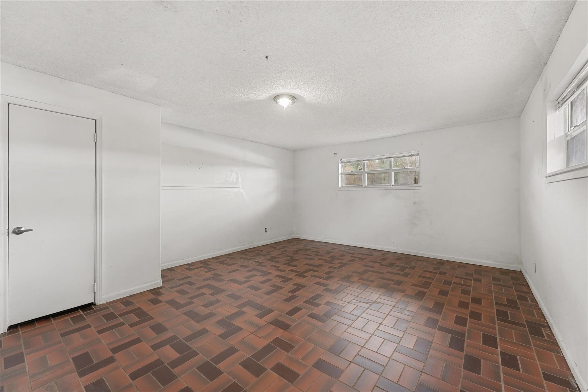 850 County Road 2145 Cleveland, TX 77327 - Photo 18 of 43 a view of empty room with wooden floor