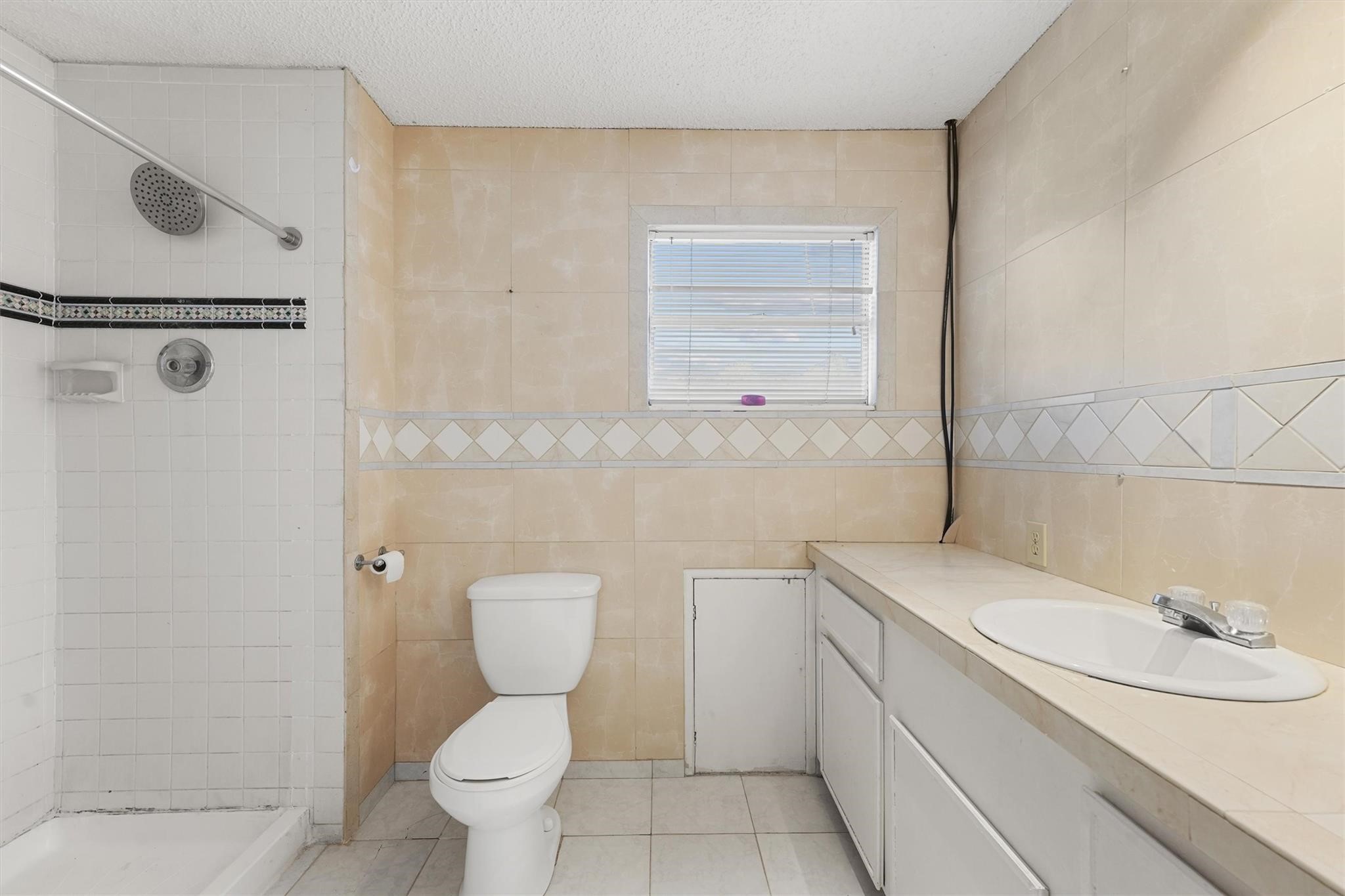 850 County Road 2145 Cleveland, TX 77327 - Photo 22 of 43 a bathroom with a toilet sink and mirror