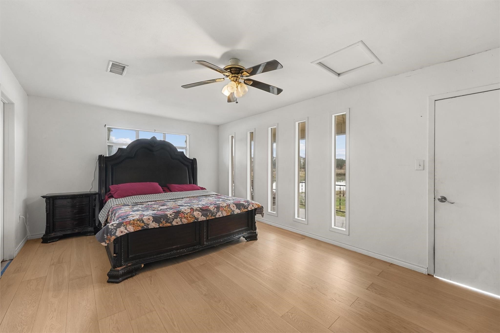850 County Road 2145 Cleveland, TX 77327 - Photo 23 of 43 a bedroom with a bed and a ceiling fan