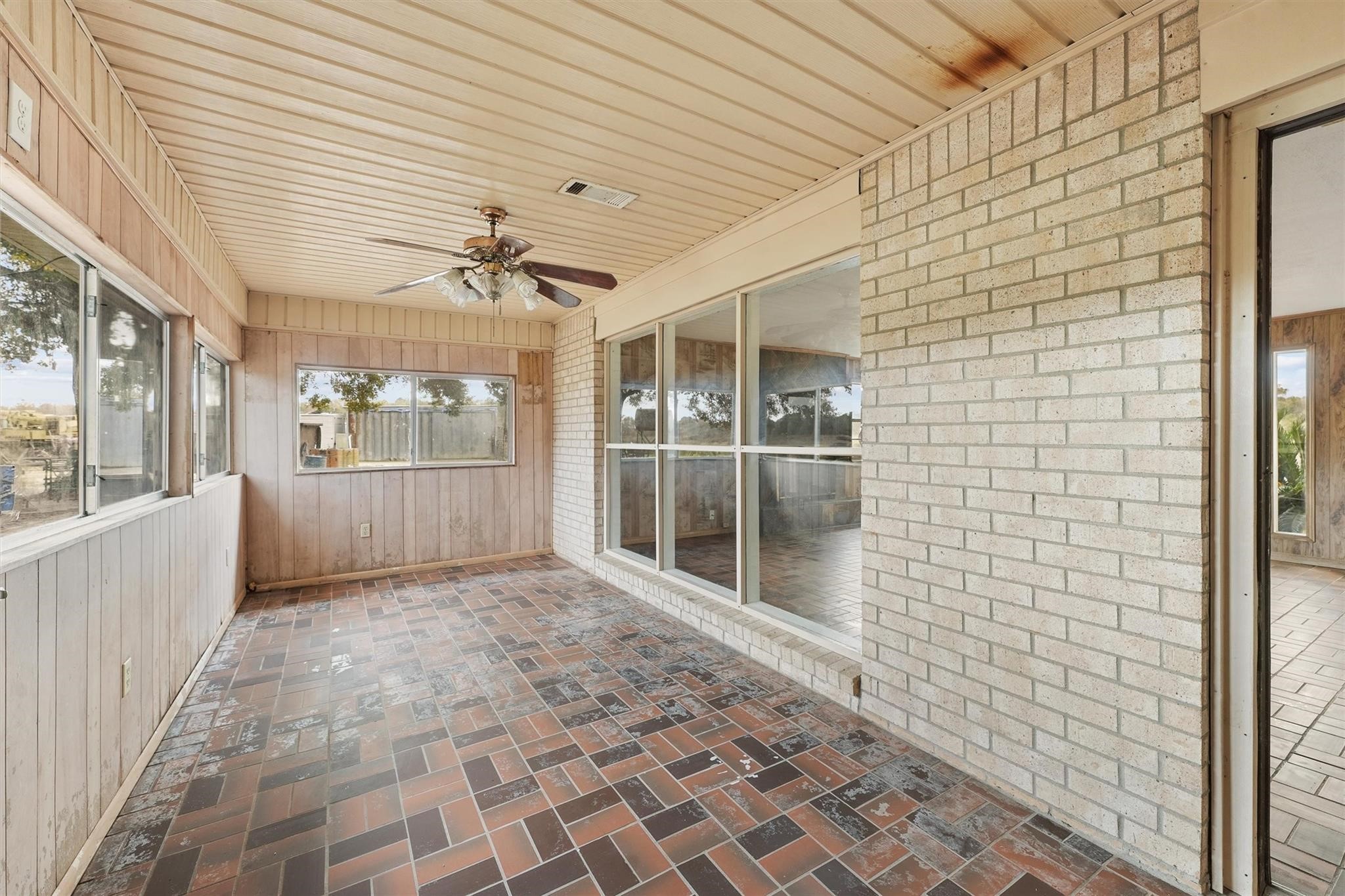 850 County Road 2145 Cleveland, TX 77327 - Photo 32 of 43 a view of a porch with a table and chairs