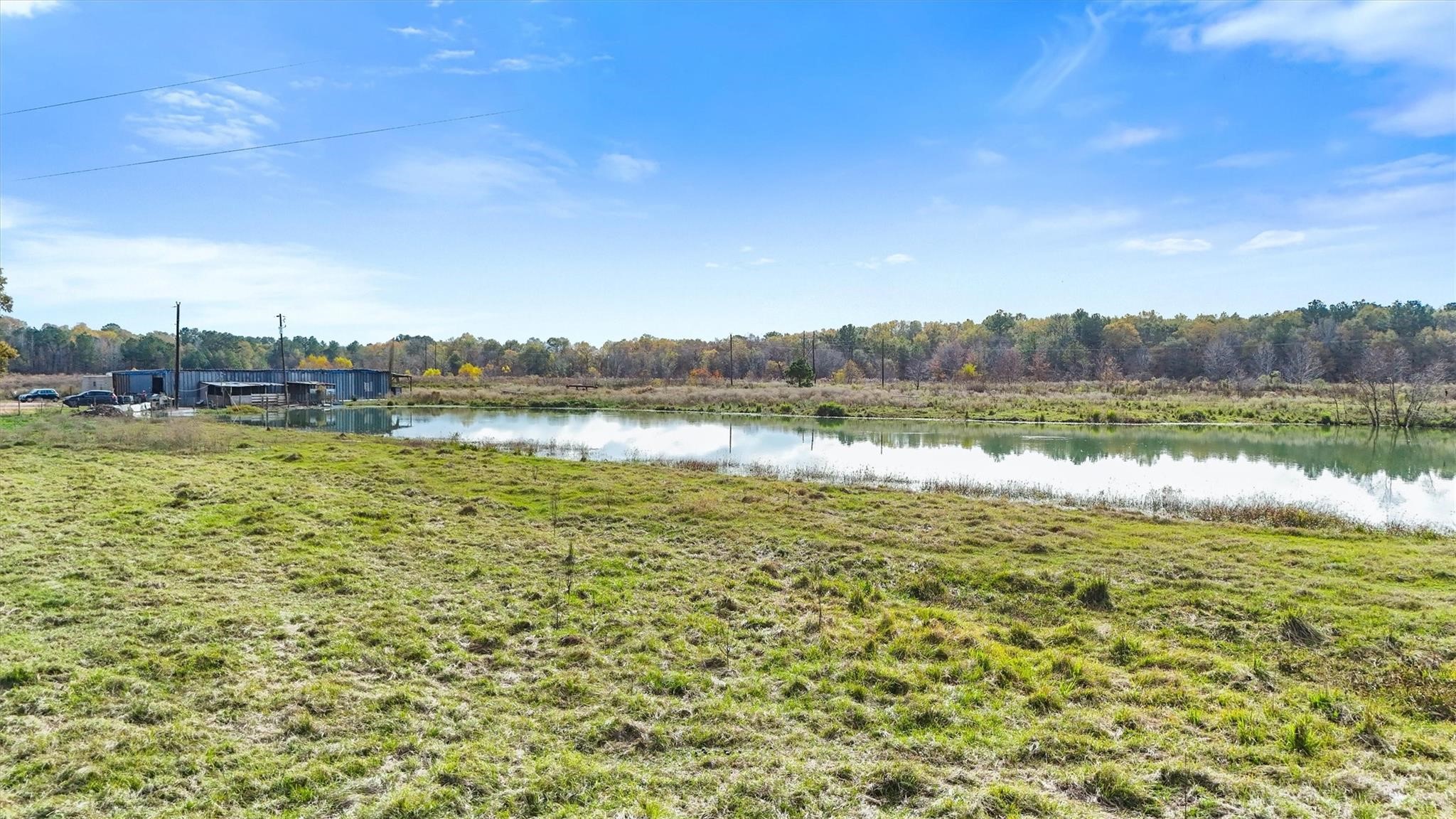 850 County Road 2145 Cleveland, TX 77327 - Photo 39 of 43 a view of a lake with houses in the back