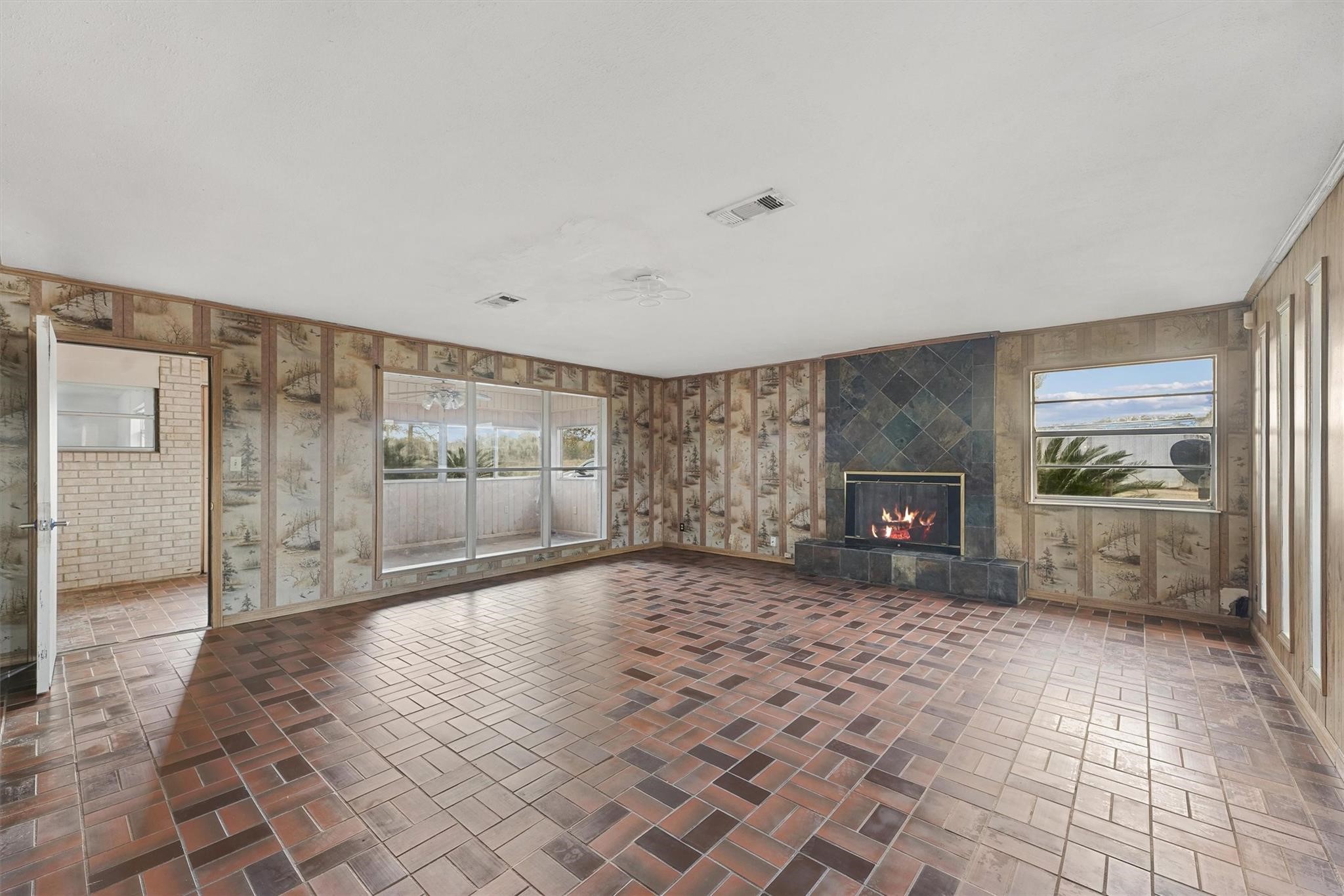 850 County Road 2145 Cleveland, TX 77327 - Photo 5 of 43 a view of a big room with windows and fireplace