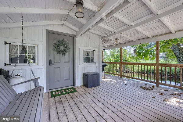 a view of a patio with wooden floor