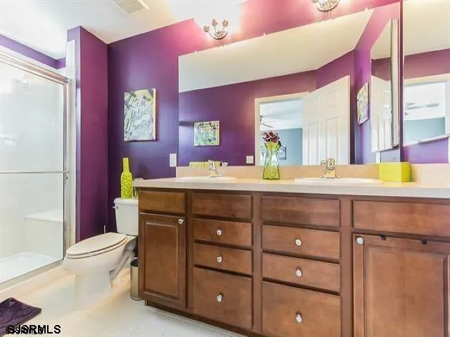 a bathroom with a sink vanity and a mirror