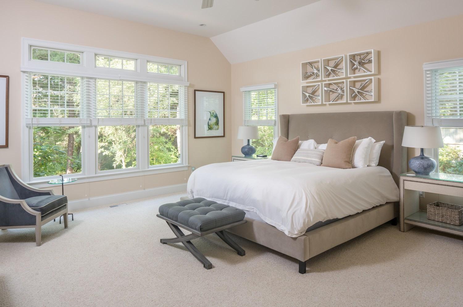721 Samoset Road Eastham, MA 02642 - Photo 12 of 32 a spacious bedroom with a bed and a large window