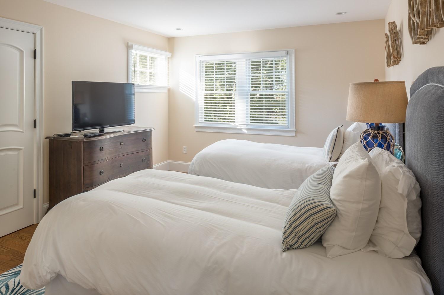 721 Samoset Road Eastham, MA 02642 - Photo 14 of 32 a bedroom with a bed and a flat screen tv