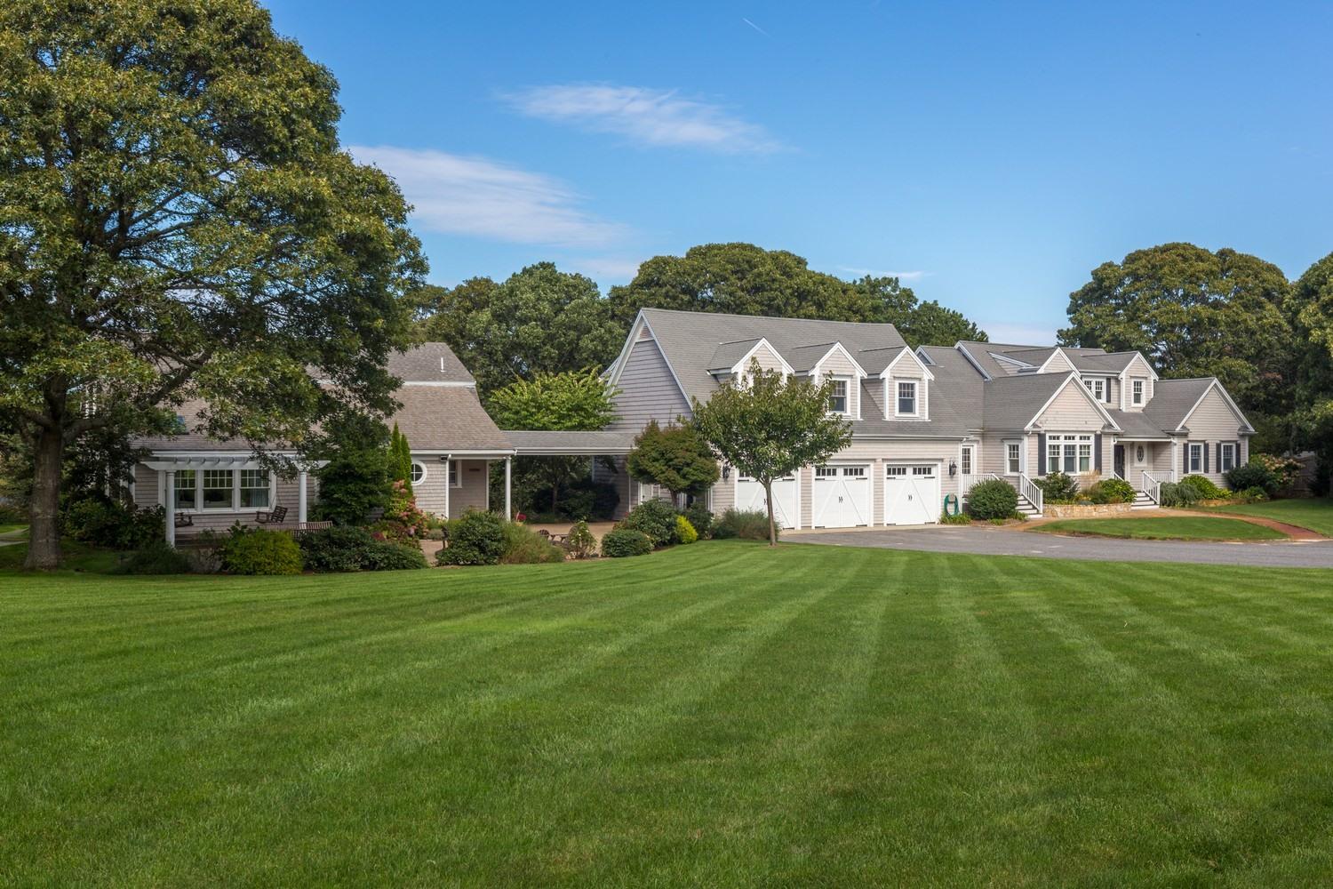 721 Samoset Road Eastham, MA 02642 - Photo 15 of 32 a front view of a house with a garden