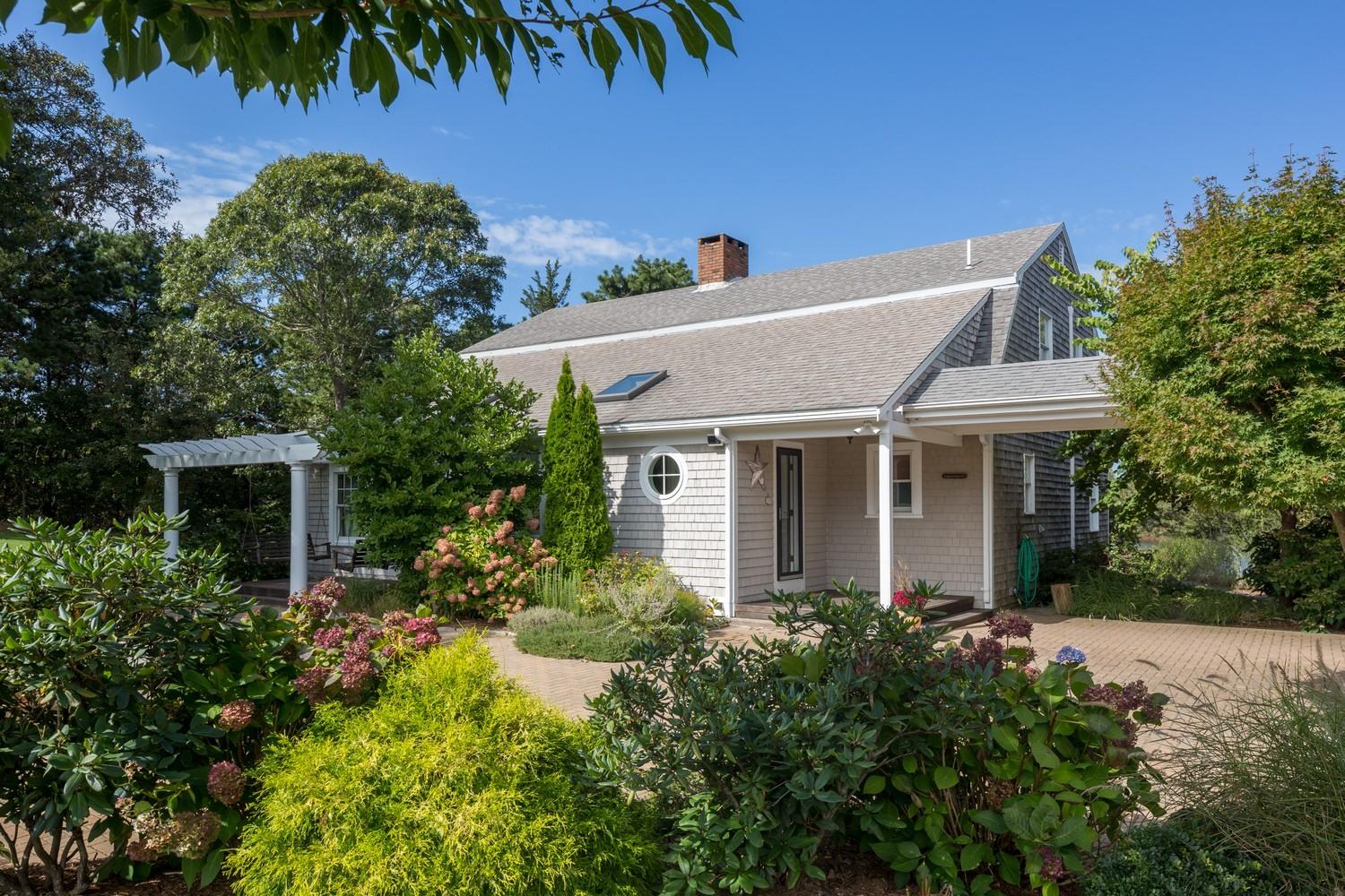 721 Samoset Road Eastham, MA 02642 - Photo 17 of 32 a aerial view of a house with a yard and potted plants